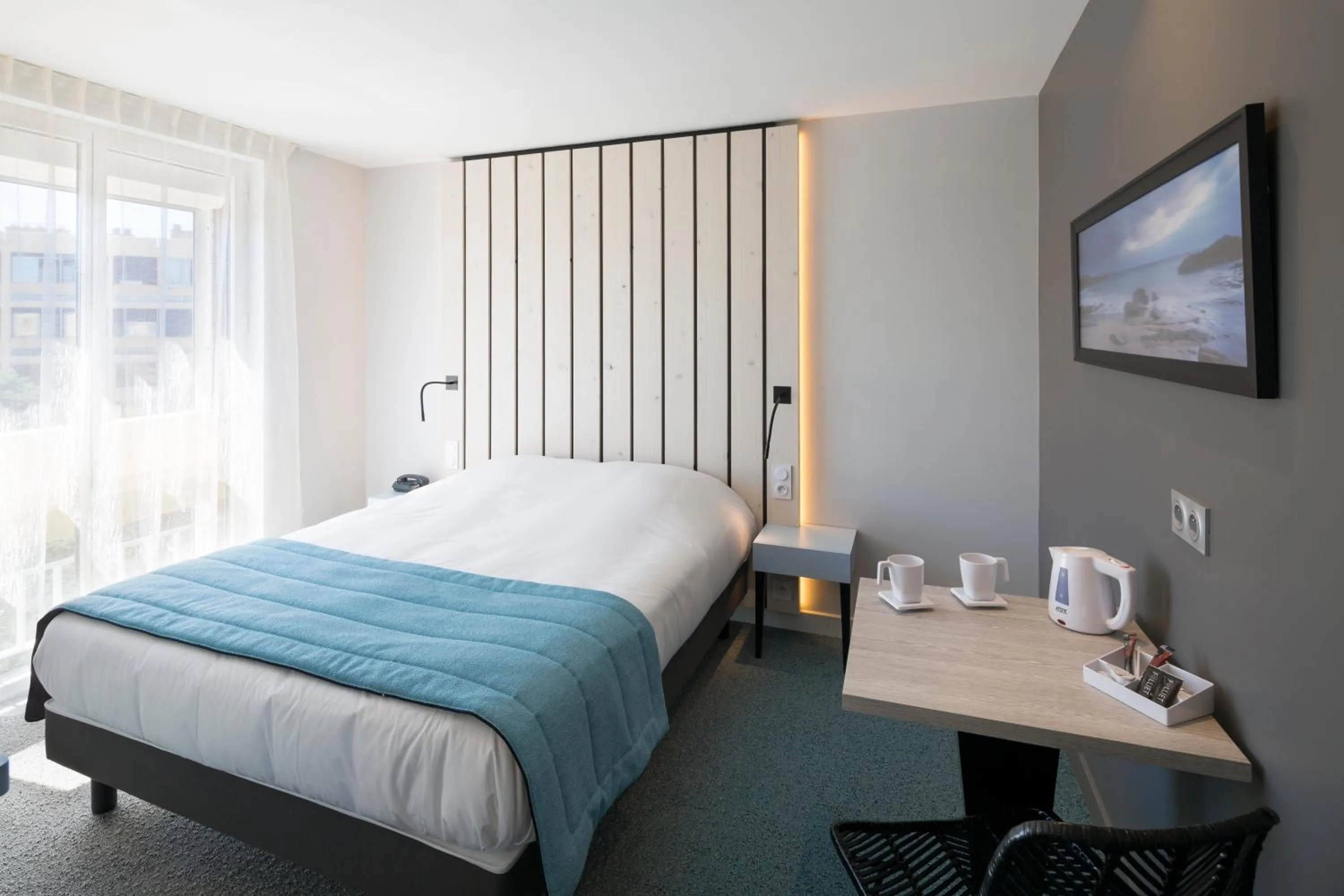 Bed in Logis Hôtel Les Pins - Opéralia