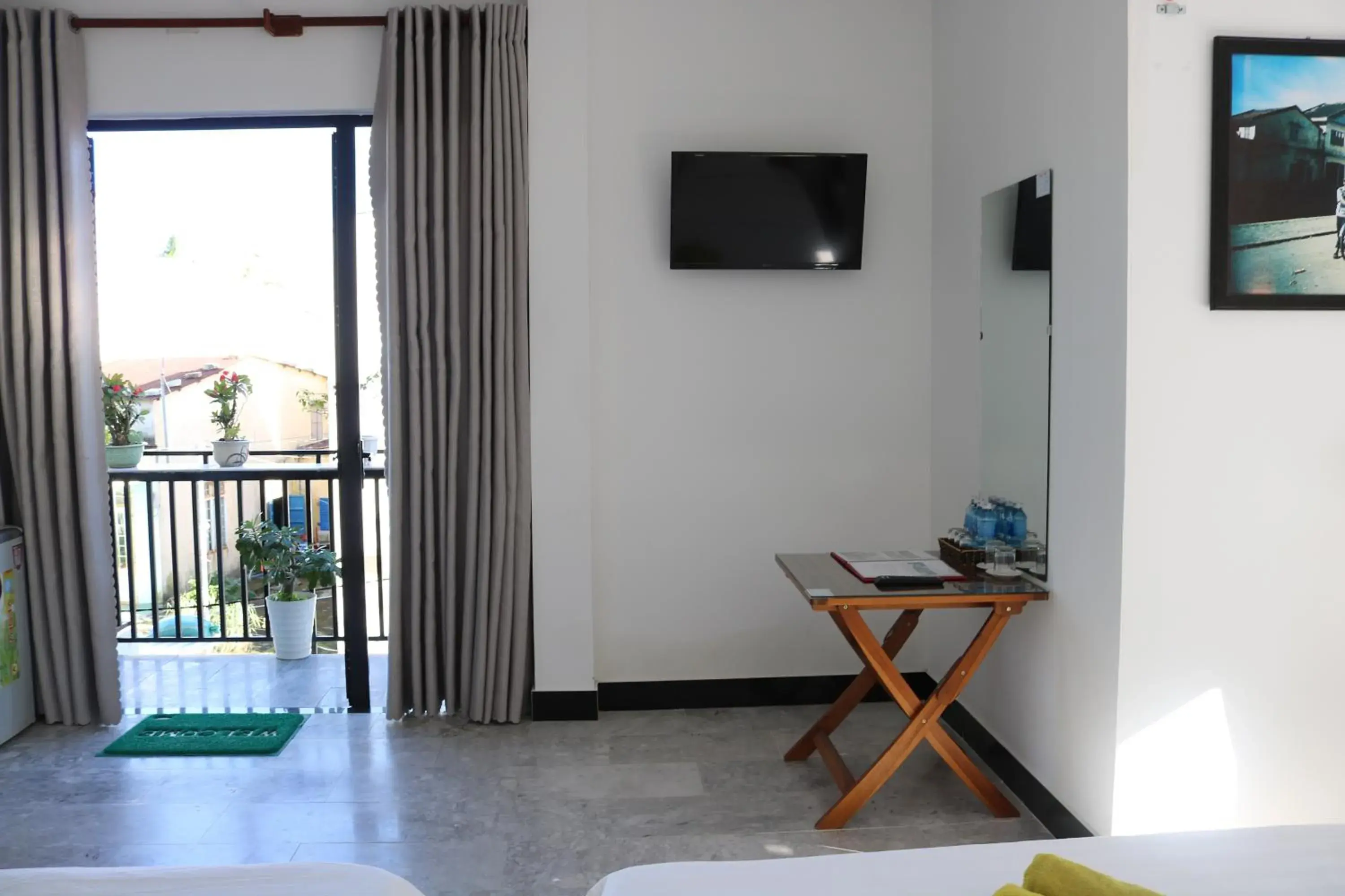 Family Room with Balcony in Green garden house Family Room with Balcony in Green garden house