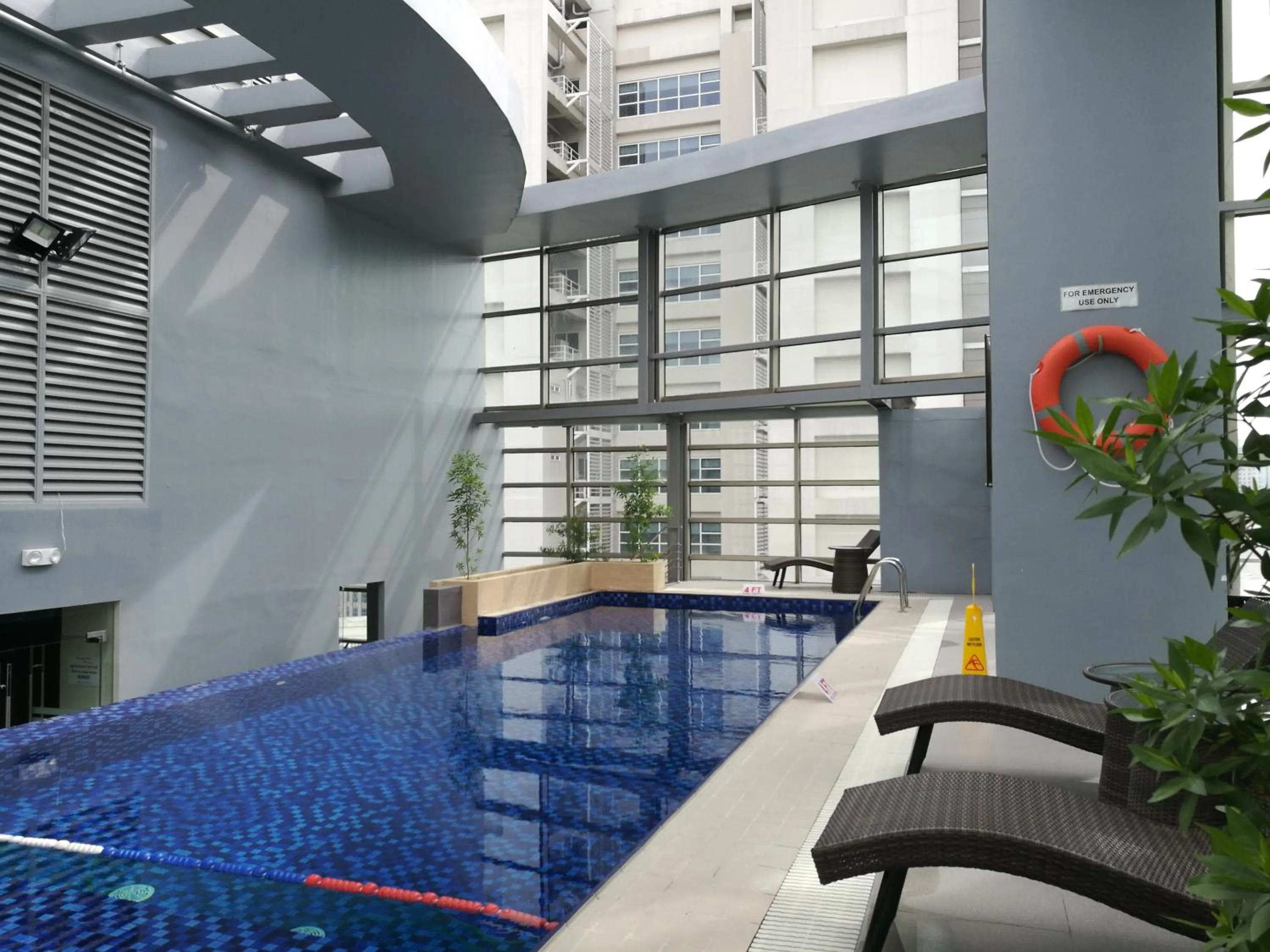 Swimming pool in Valero Grand Suites by Swiss-Belhotel