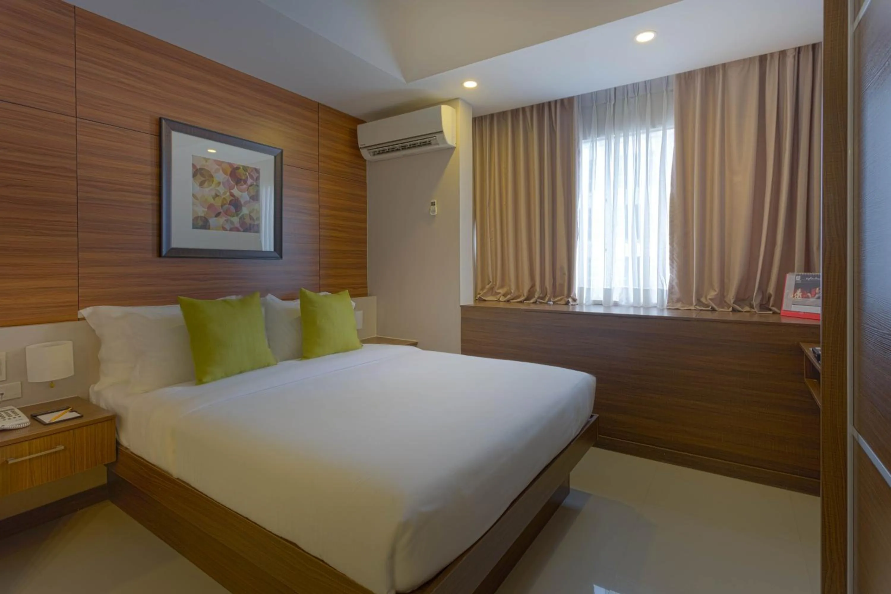 Bed in Valero Grand Suites by Swiss-Belhotel