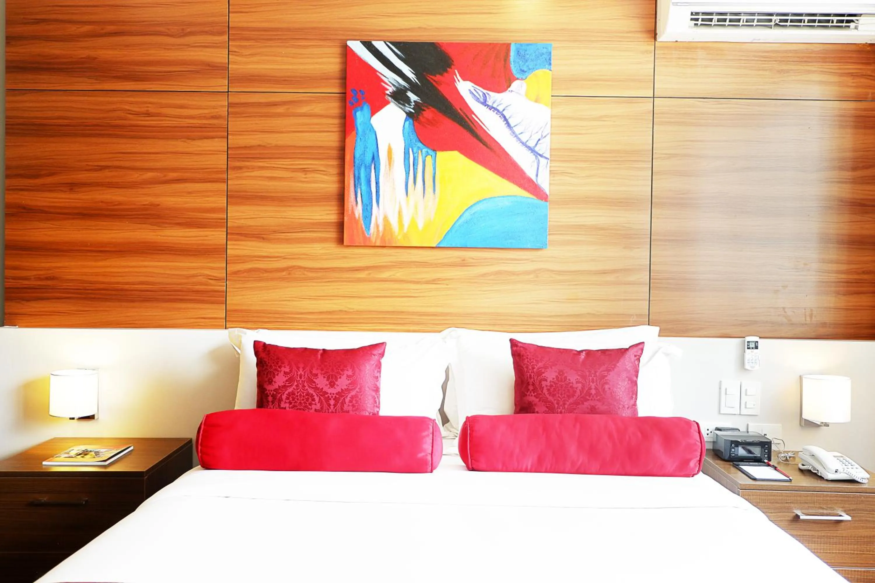 Bed in Valero Grand Suites by Swiss-Belhotel