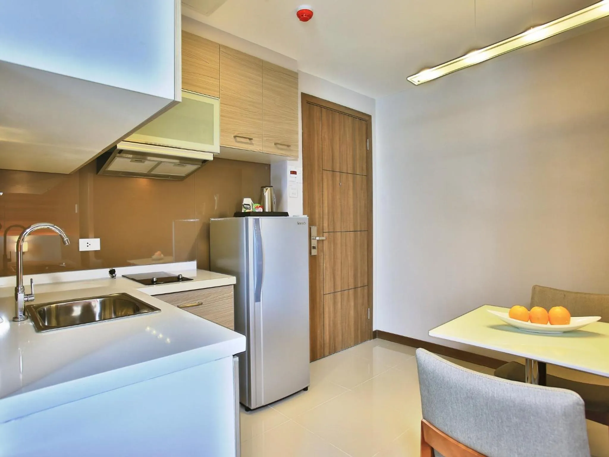 Kitchen or kitchenette in Valero Grand Suites by Swiss-Belhotel