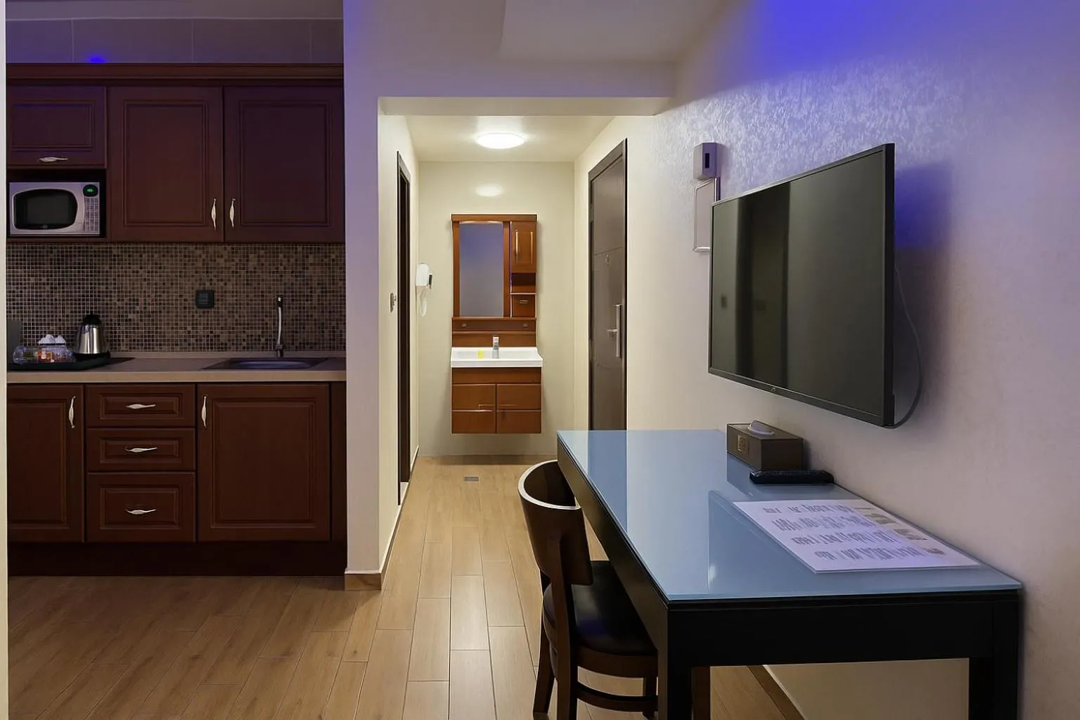 Communal lounge/ TV room in Aljamal Hotel