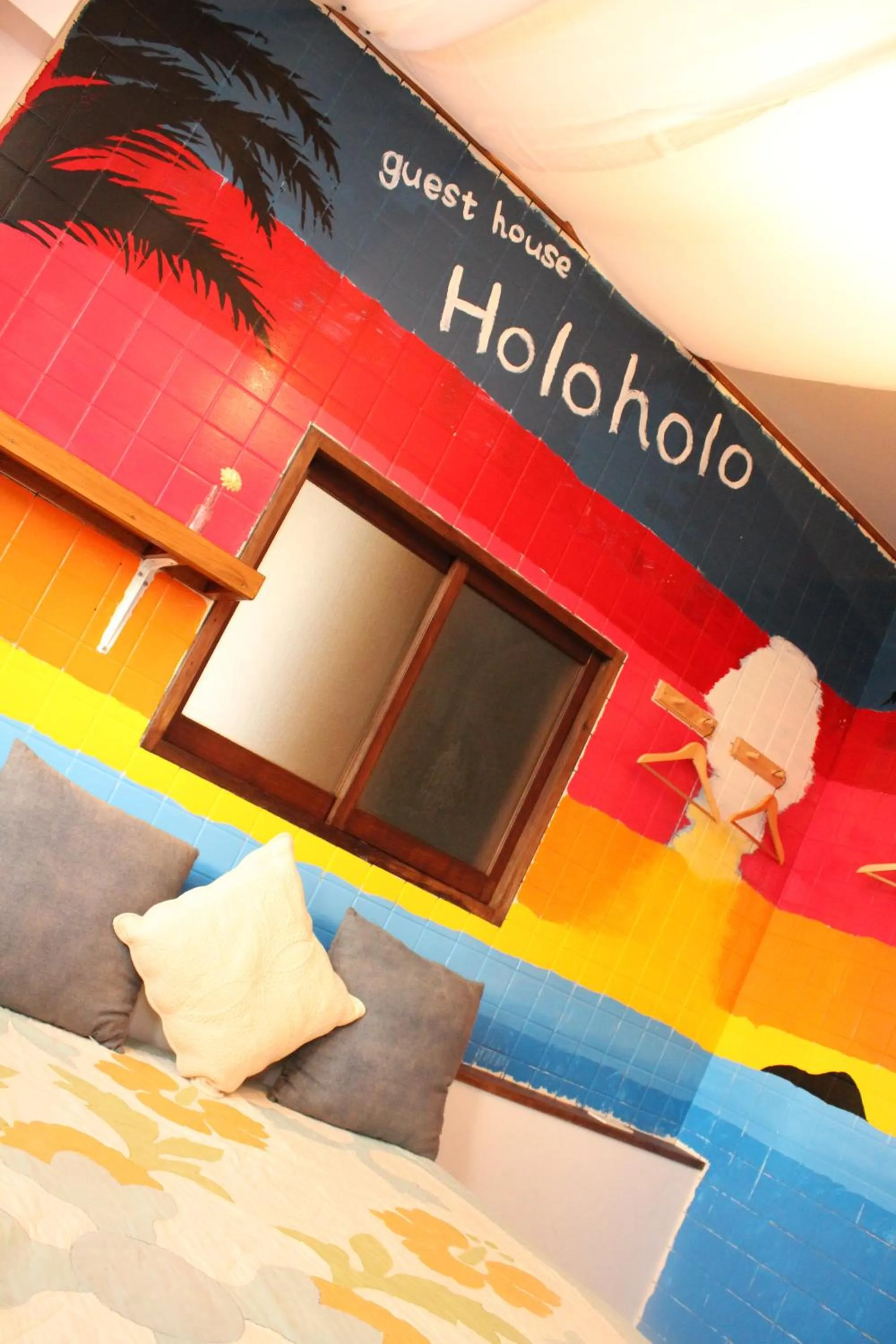 Bed in guest house Holoholo Ishigakijima