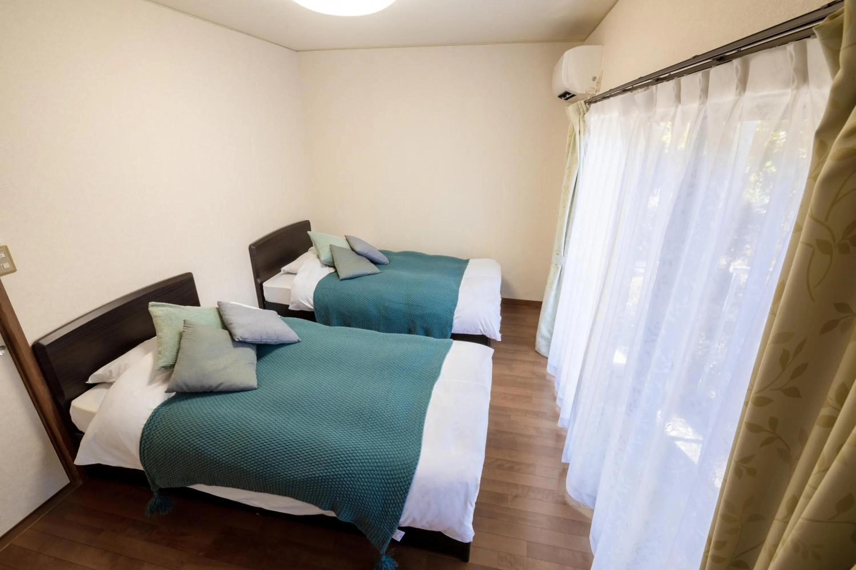 Photo of the whole room, Bed in Le Nessa Akazawa