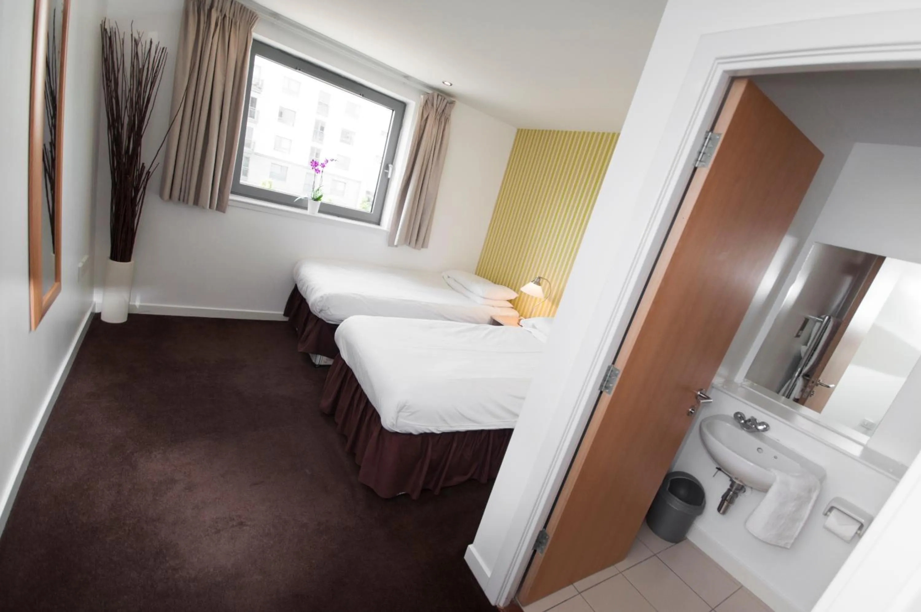 Toilet, Bed in Ocean Serviced Apartments