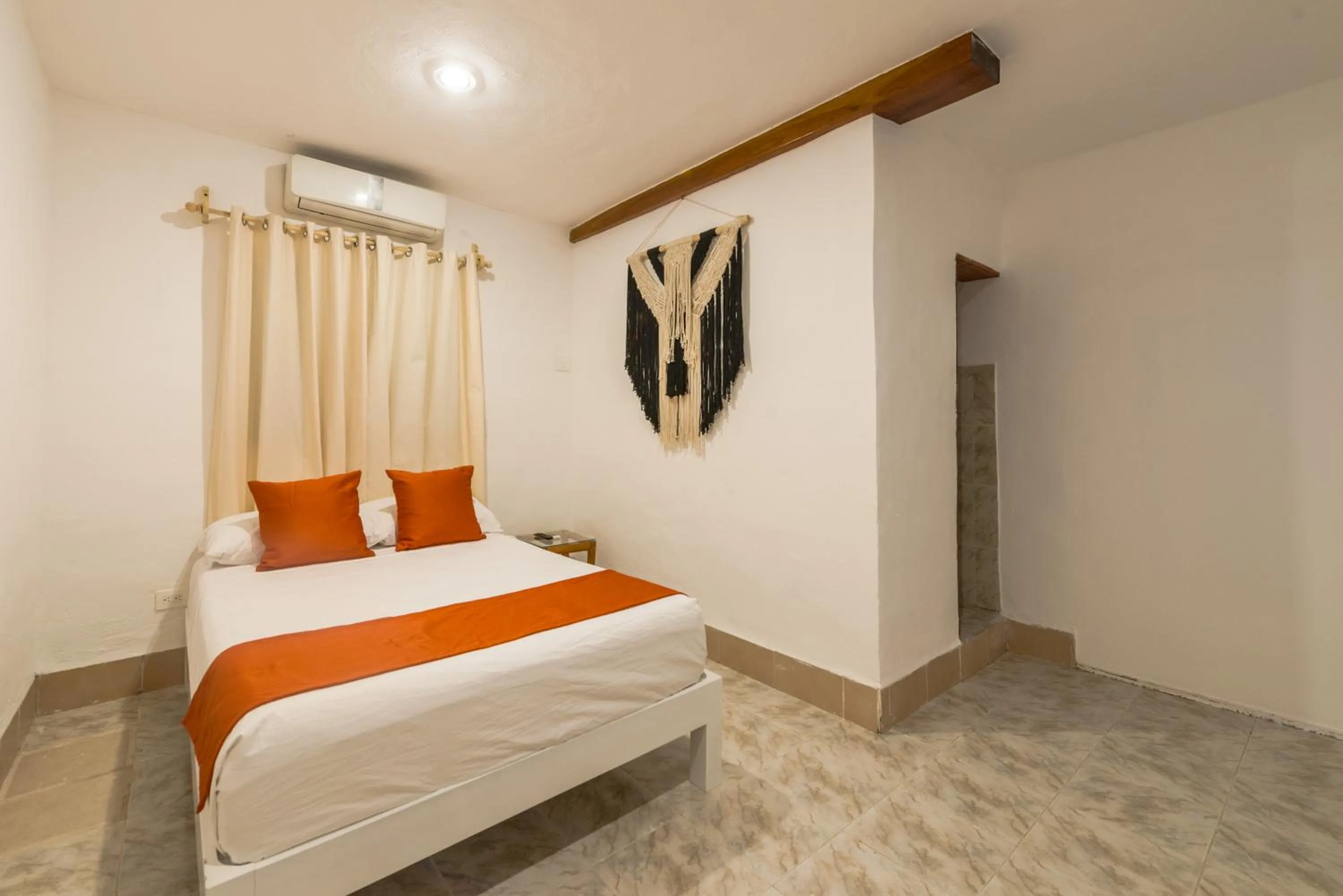 Bed in Hotel Caracol Puerto Morelos