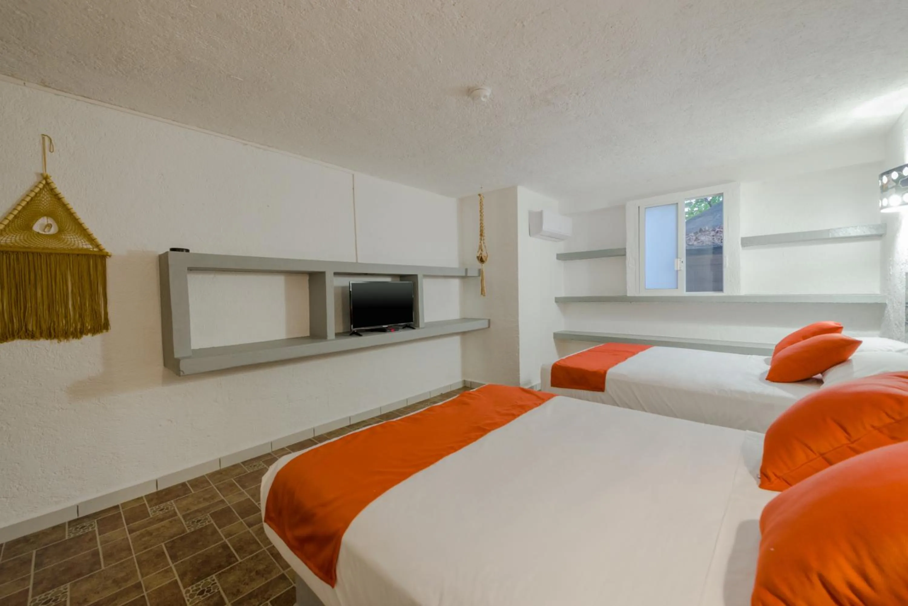 Bed in Hotel Caracol Puerto Morelos