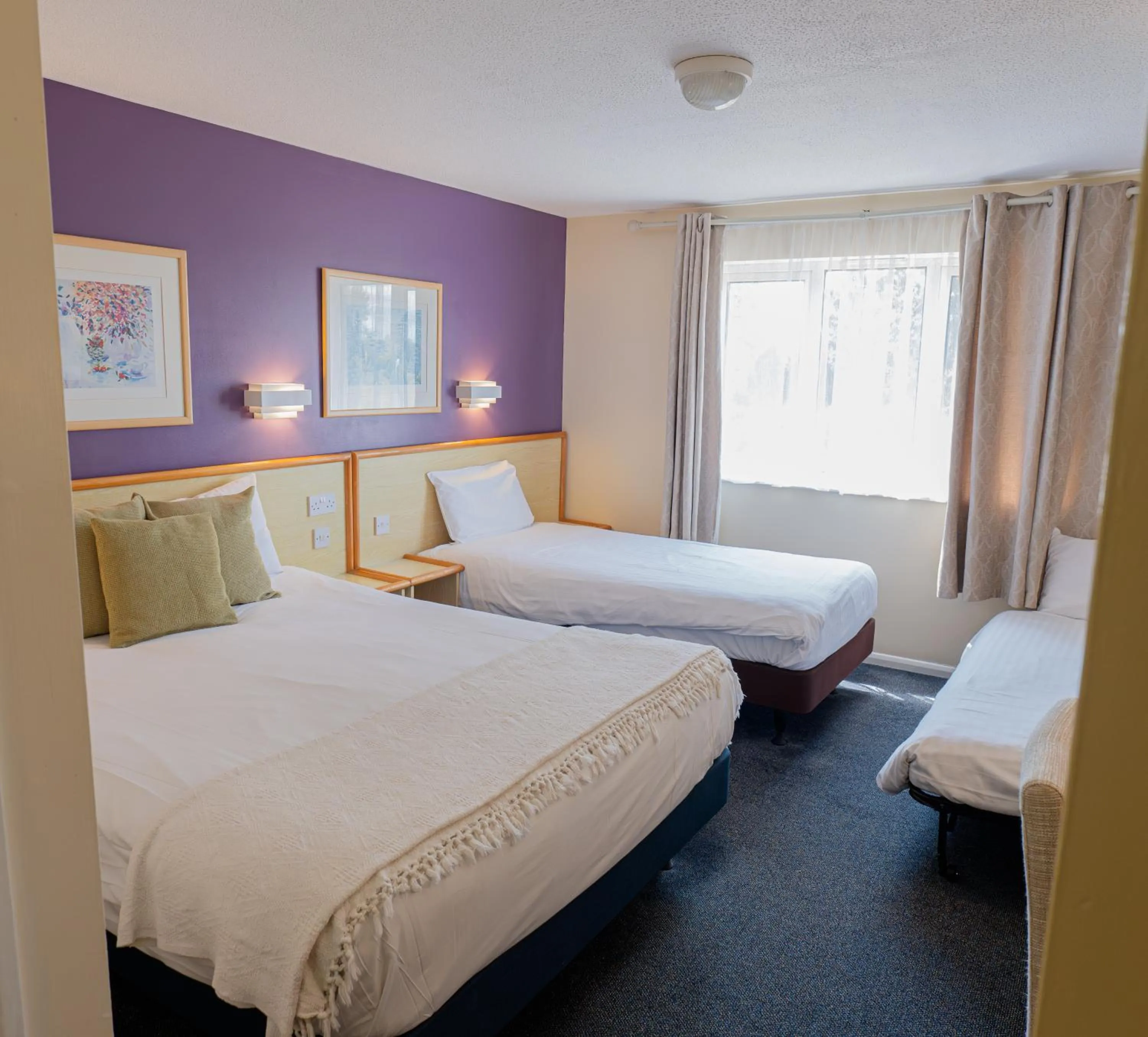 Bed in Travel Plaza Hotel