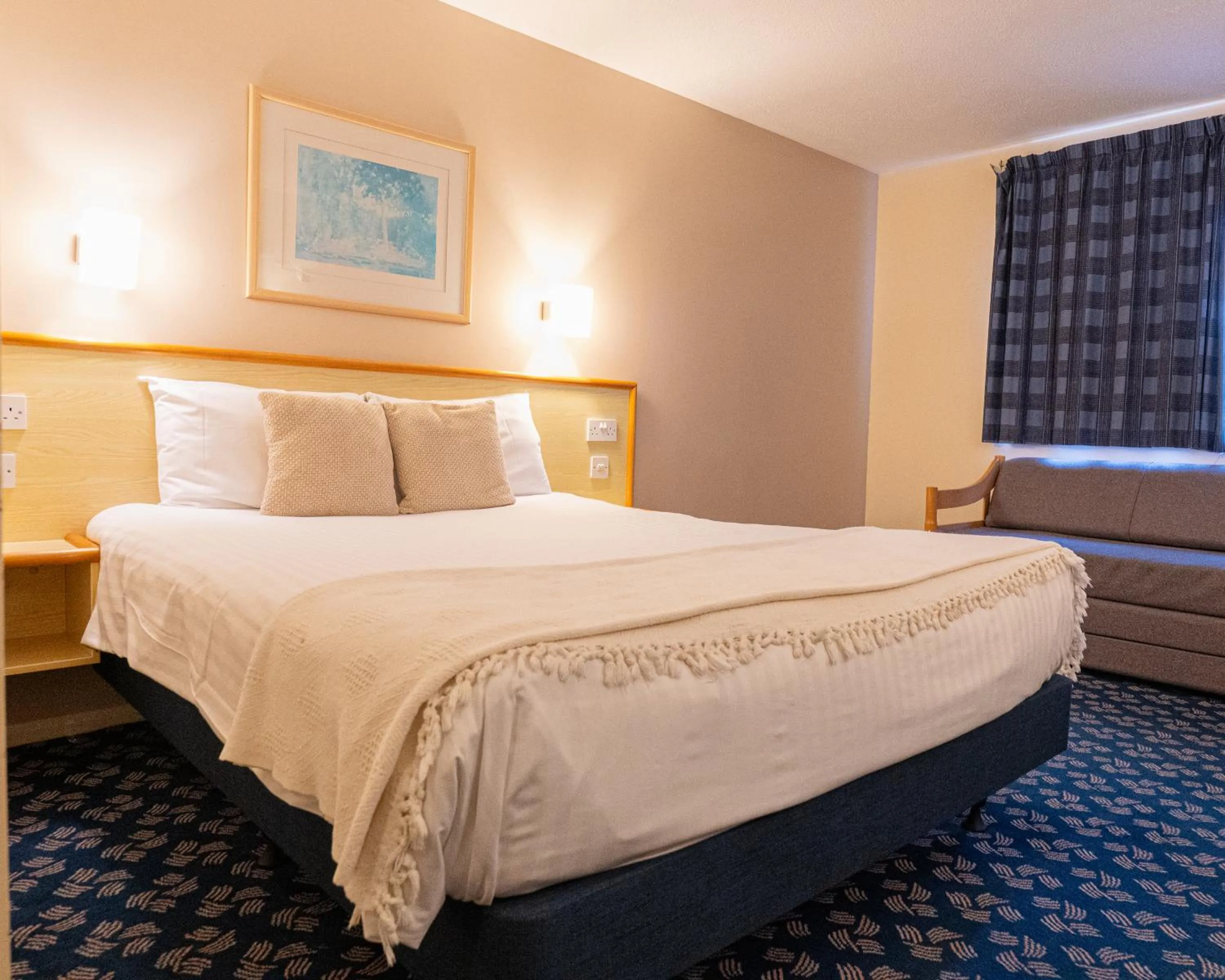 Bed in Travel Plaza Hotel