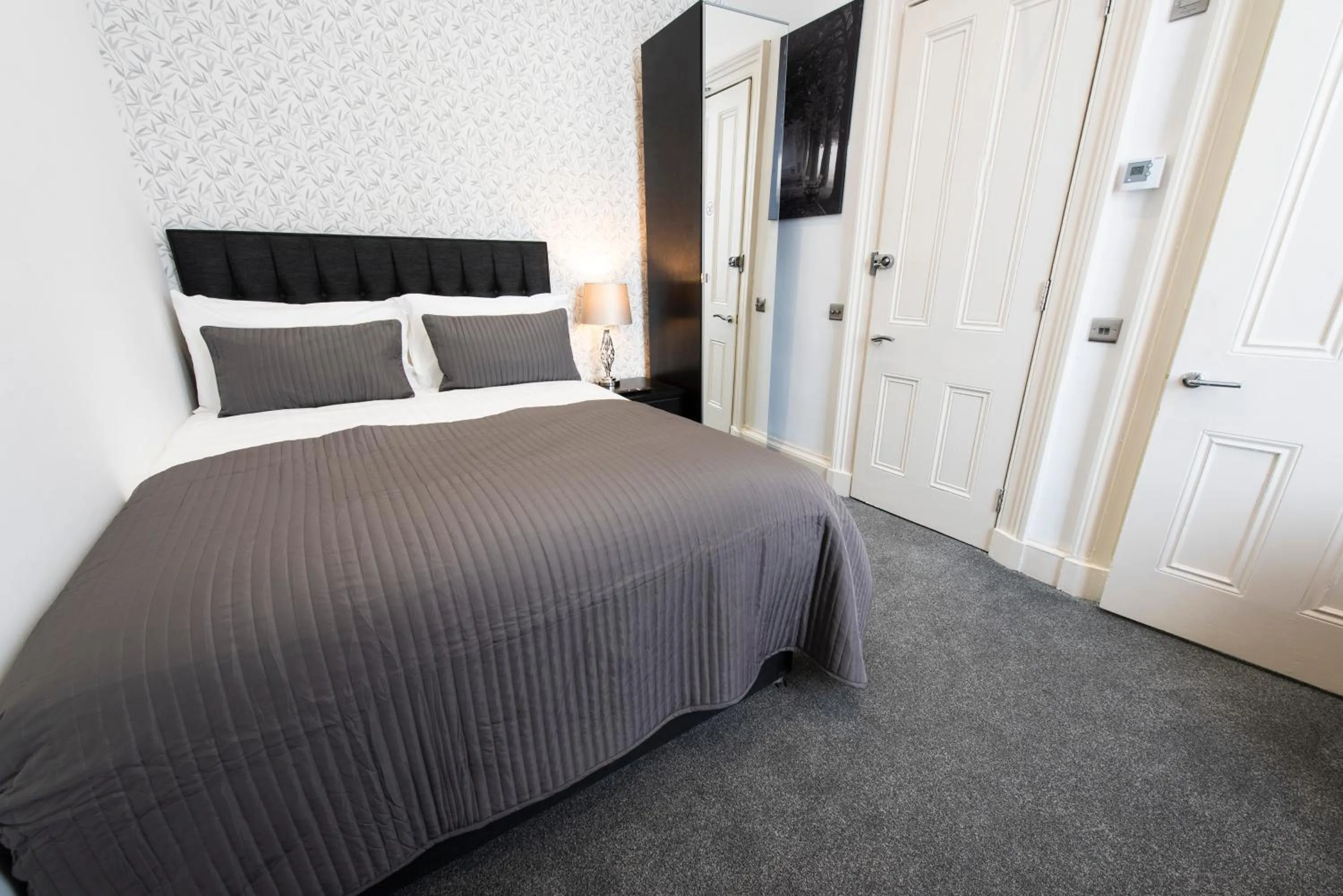 Bed in Grosvenor Suites