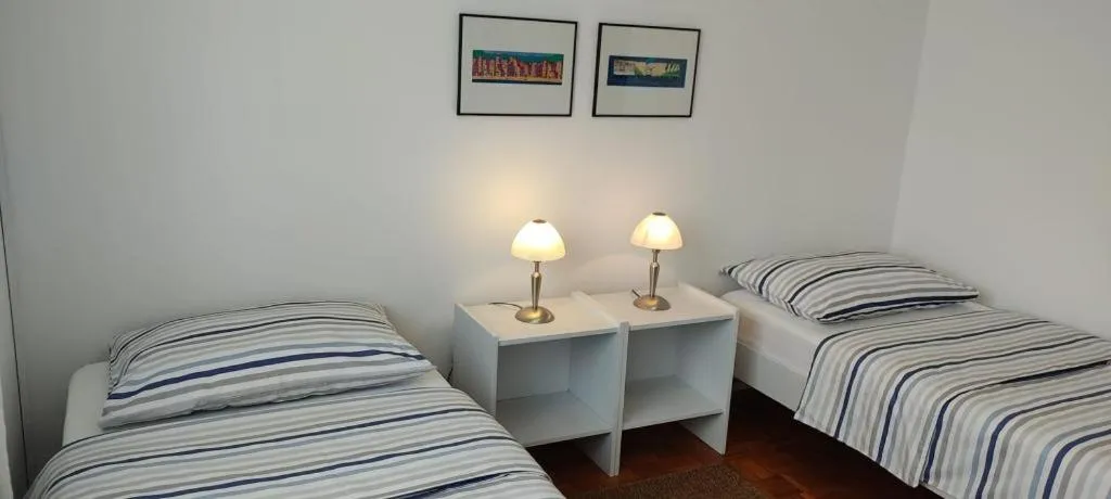 Bed in Amazing seaview apartment with a balcony near the beach - Kneza Trpimira I