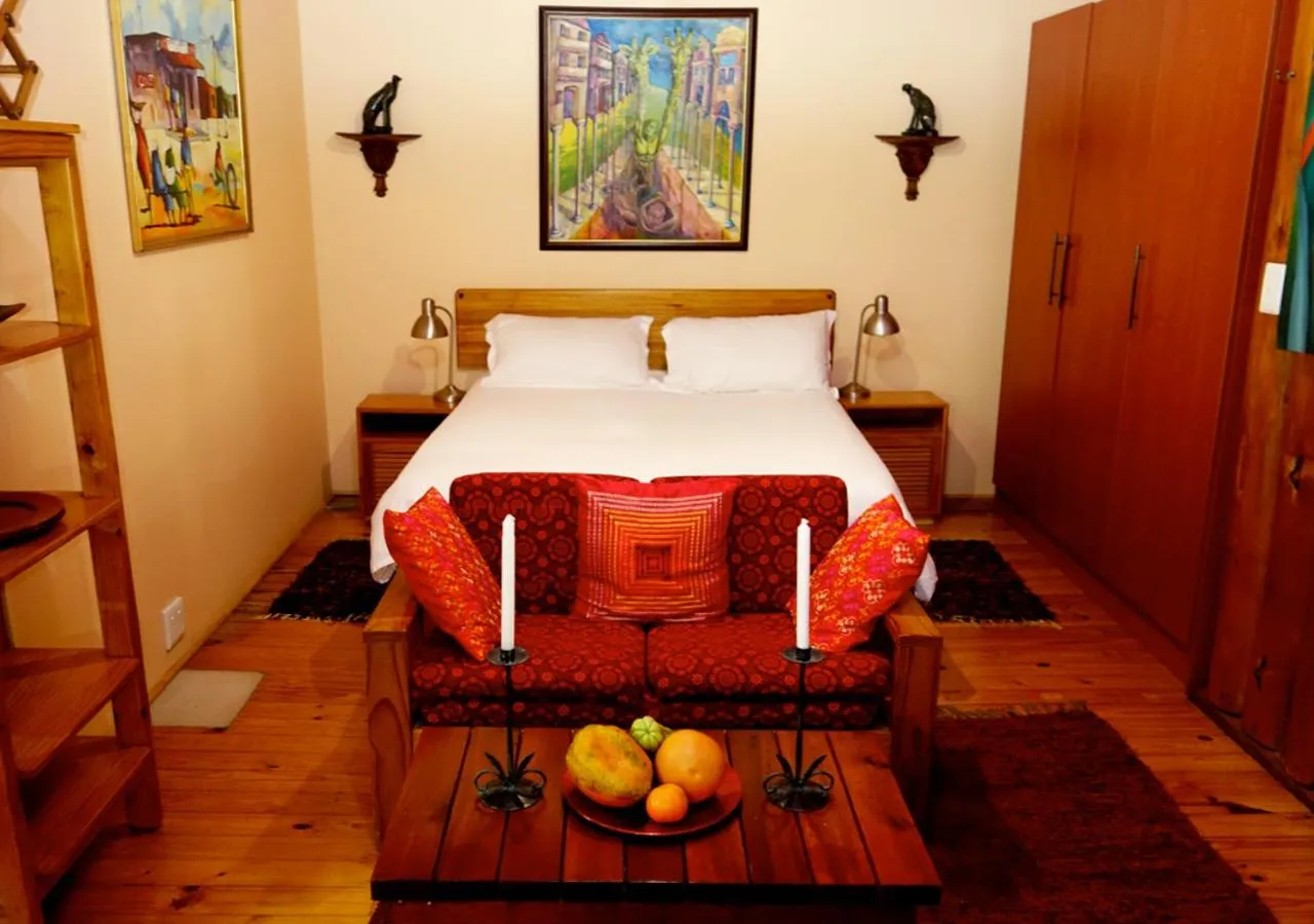 Bed in Veki's Village Cottages