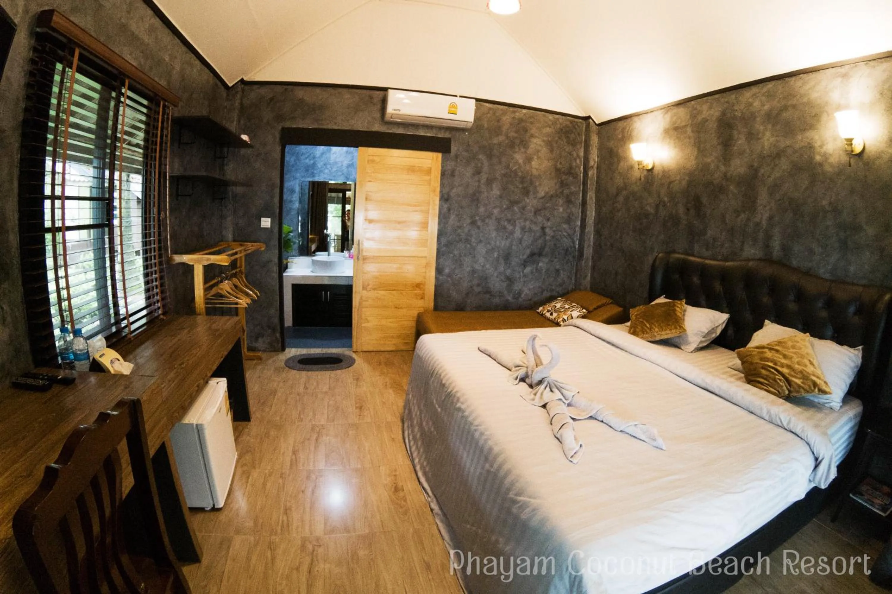 Bed in Phayam Coconut Beach Resort