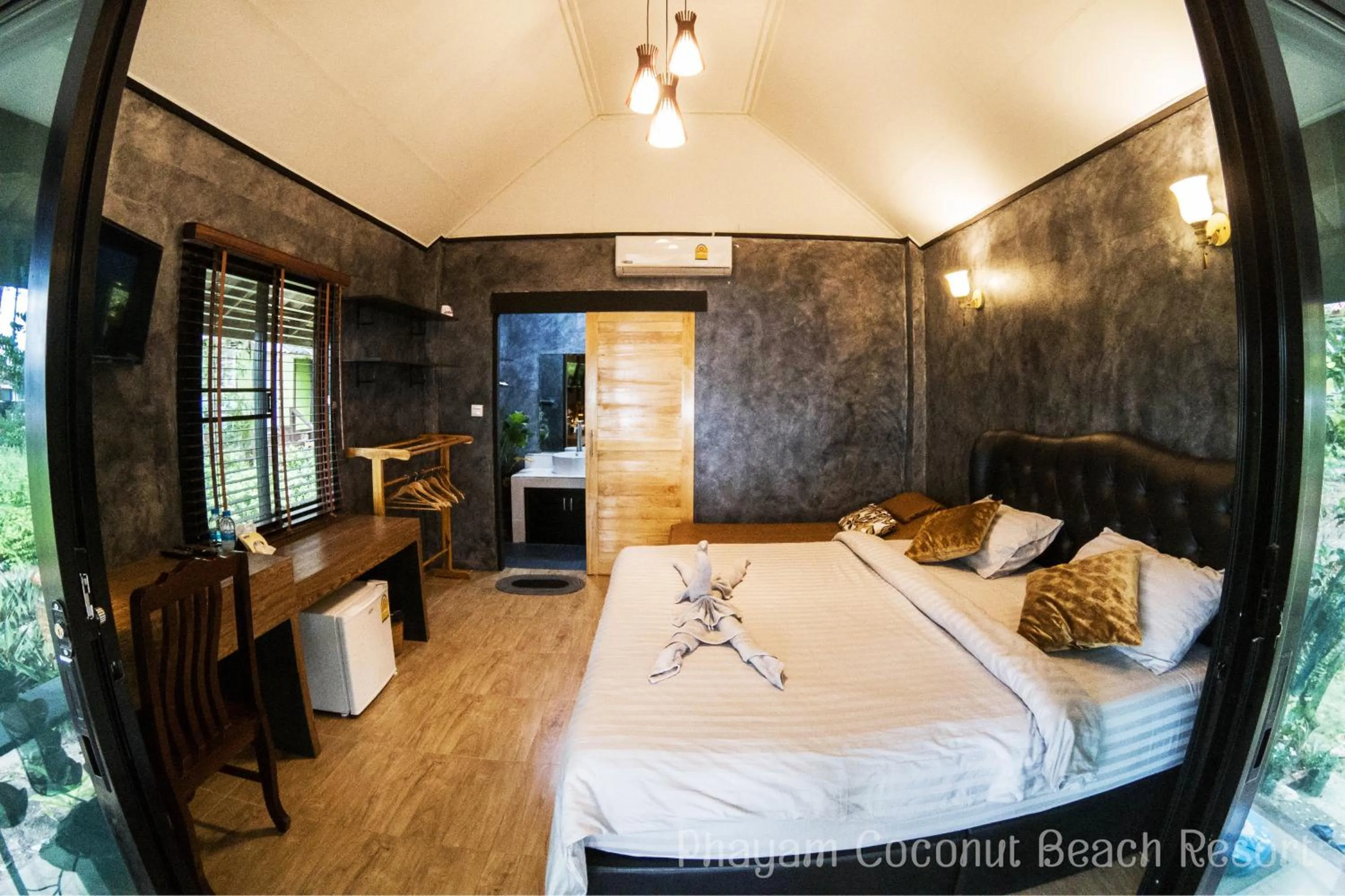 Bed in Phayam Coconut Beach Resort