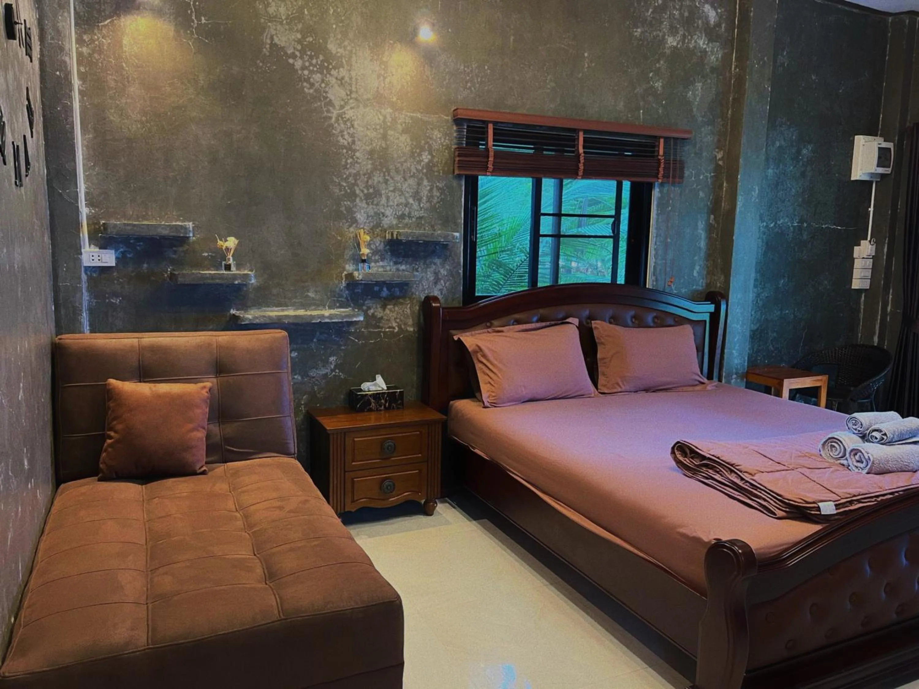 Bed in Phayam Coconut Beach Resort