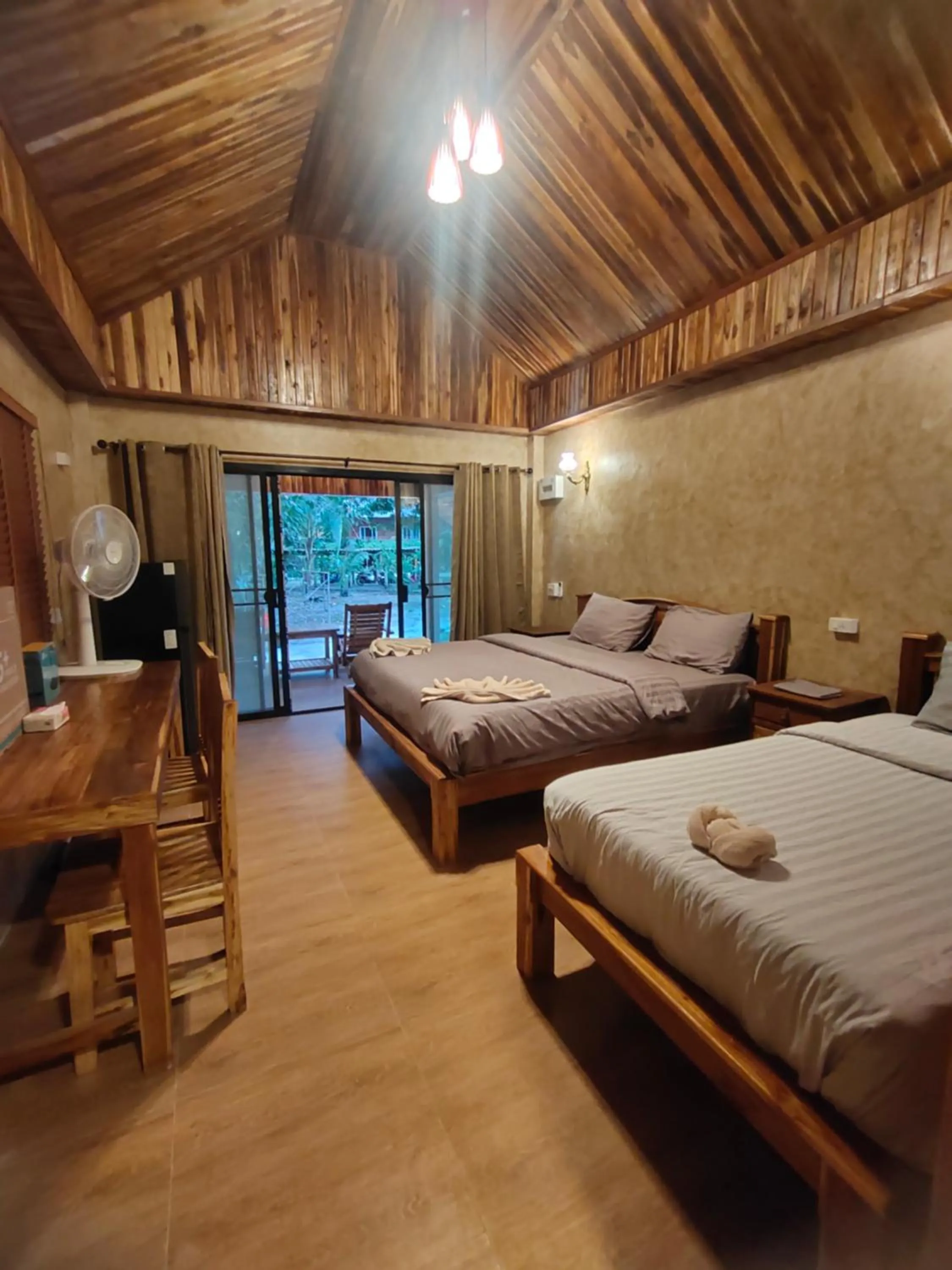 Bed in Phayam Coconut Beach Resort