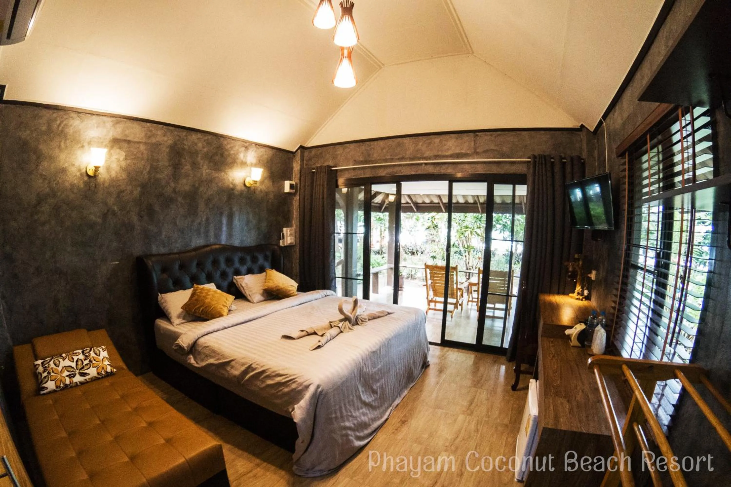 Bed in Phayam Coconut Beach Resort