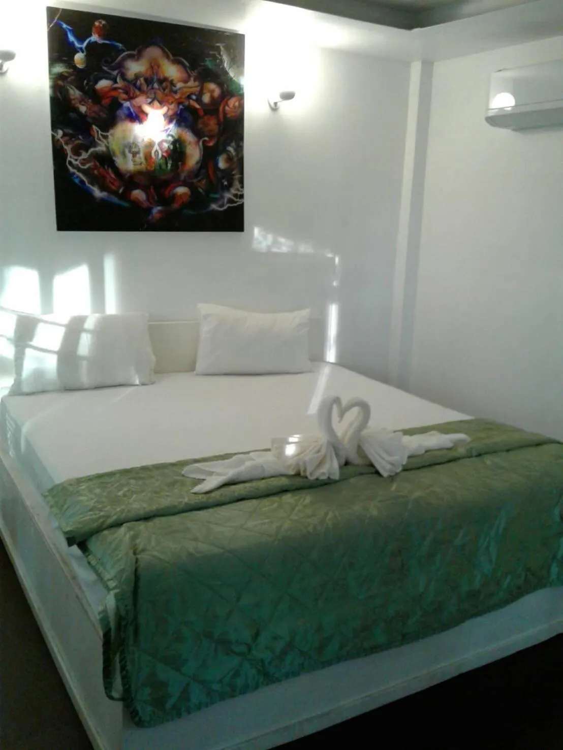 Bed in Phayam Coconut Beach Resort