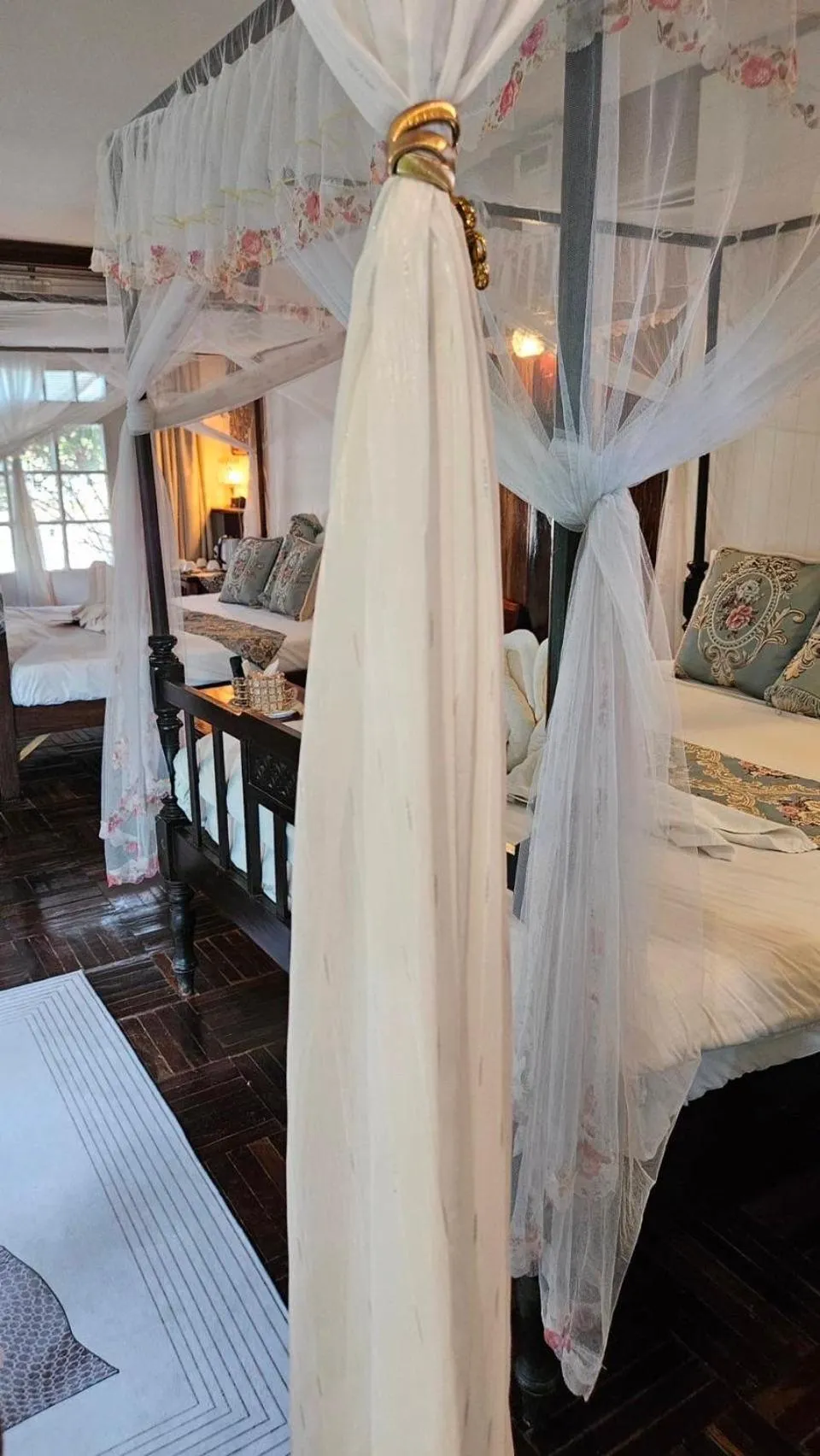 Bed in The Antique Riverside Resort