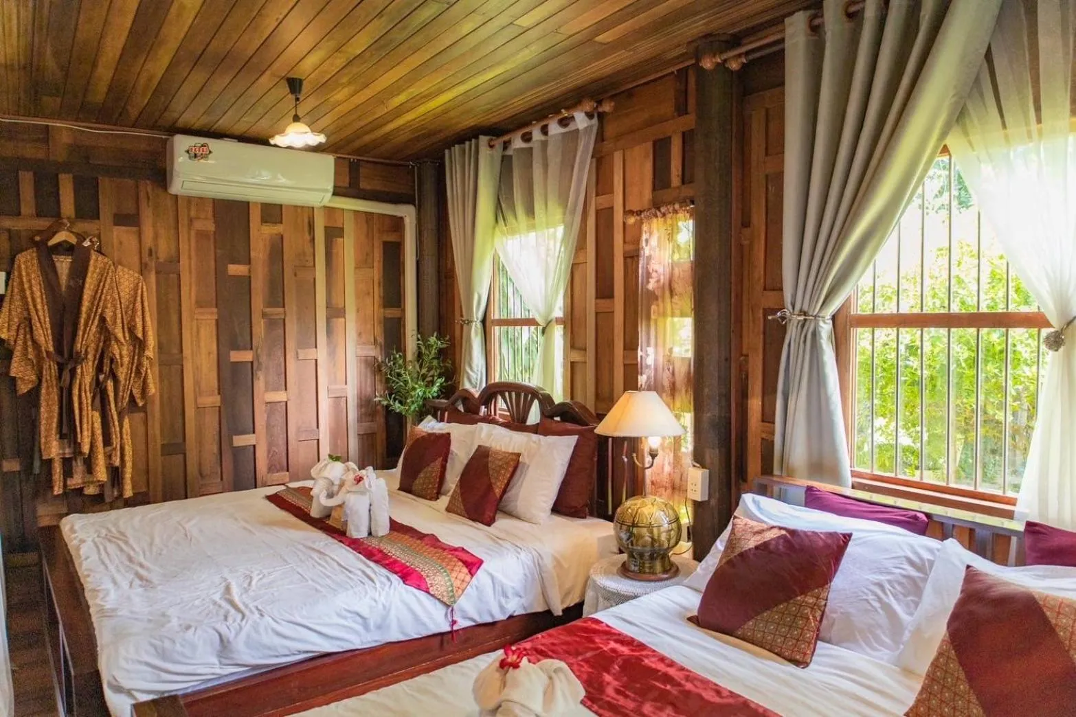 Bed in The Antique Riverside Resort