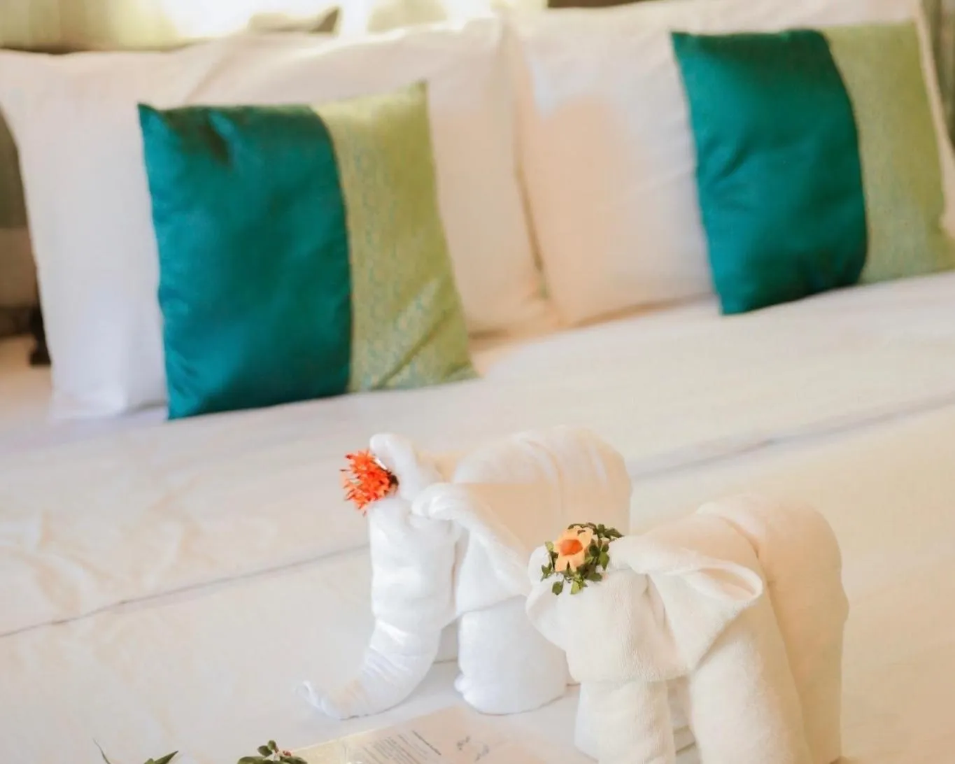 Bed in The Antique Riverside Resort