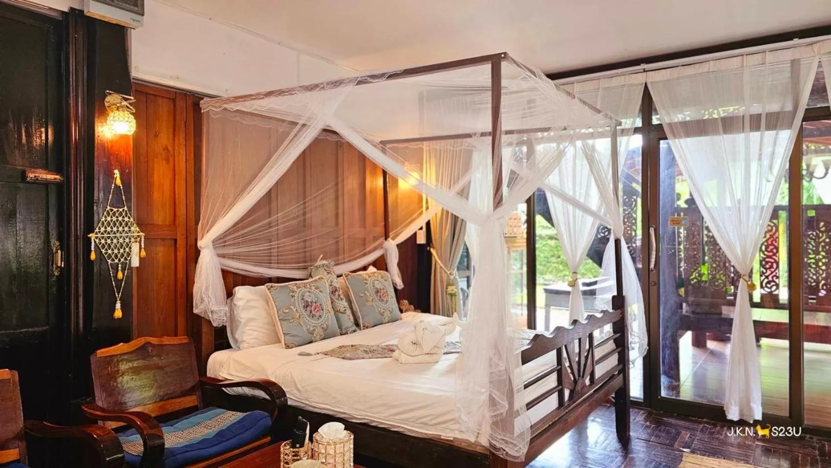 Bed in The Antique Riverside Resort