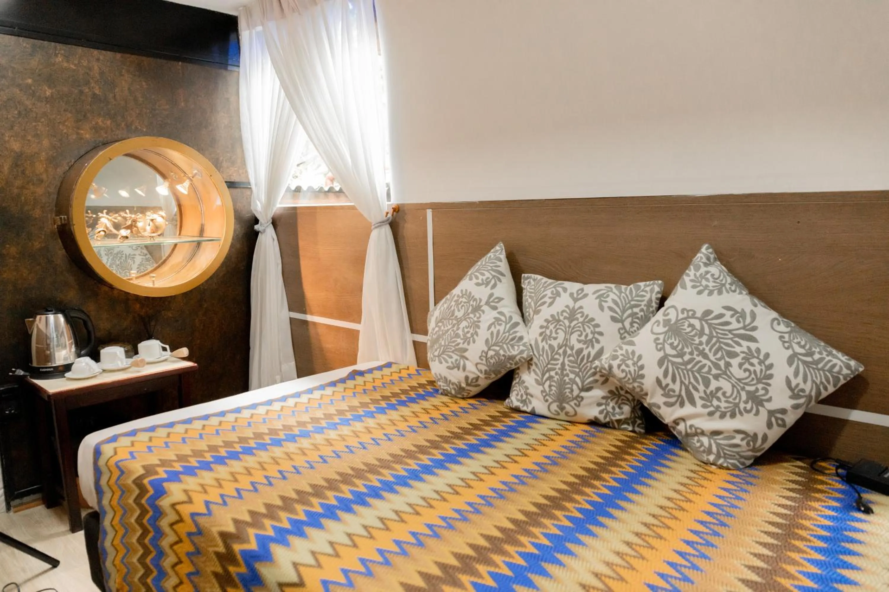 Bed in The Antique Riverside Resort