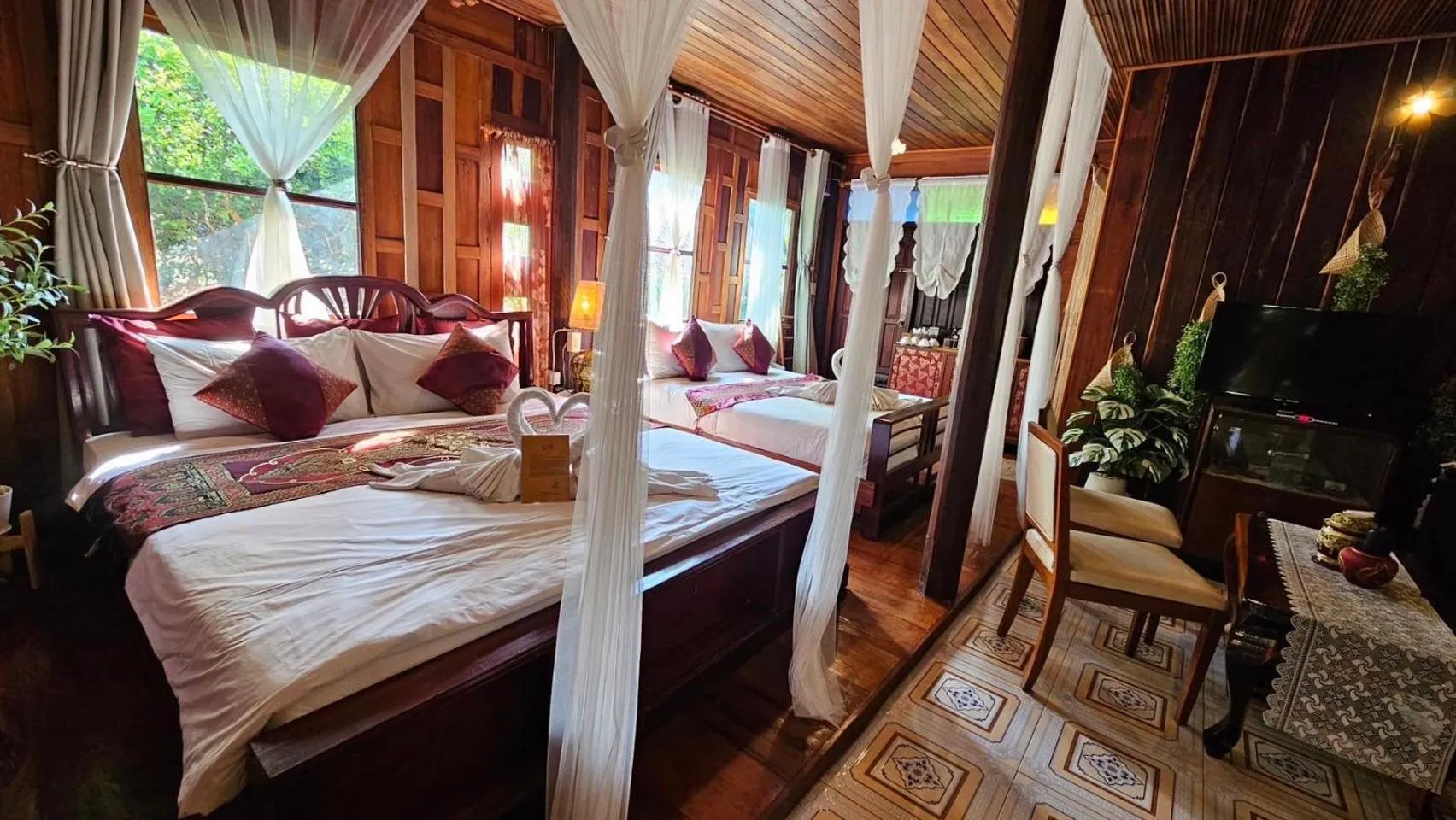 Bed in The Antique Riverside Resort