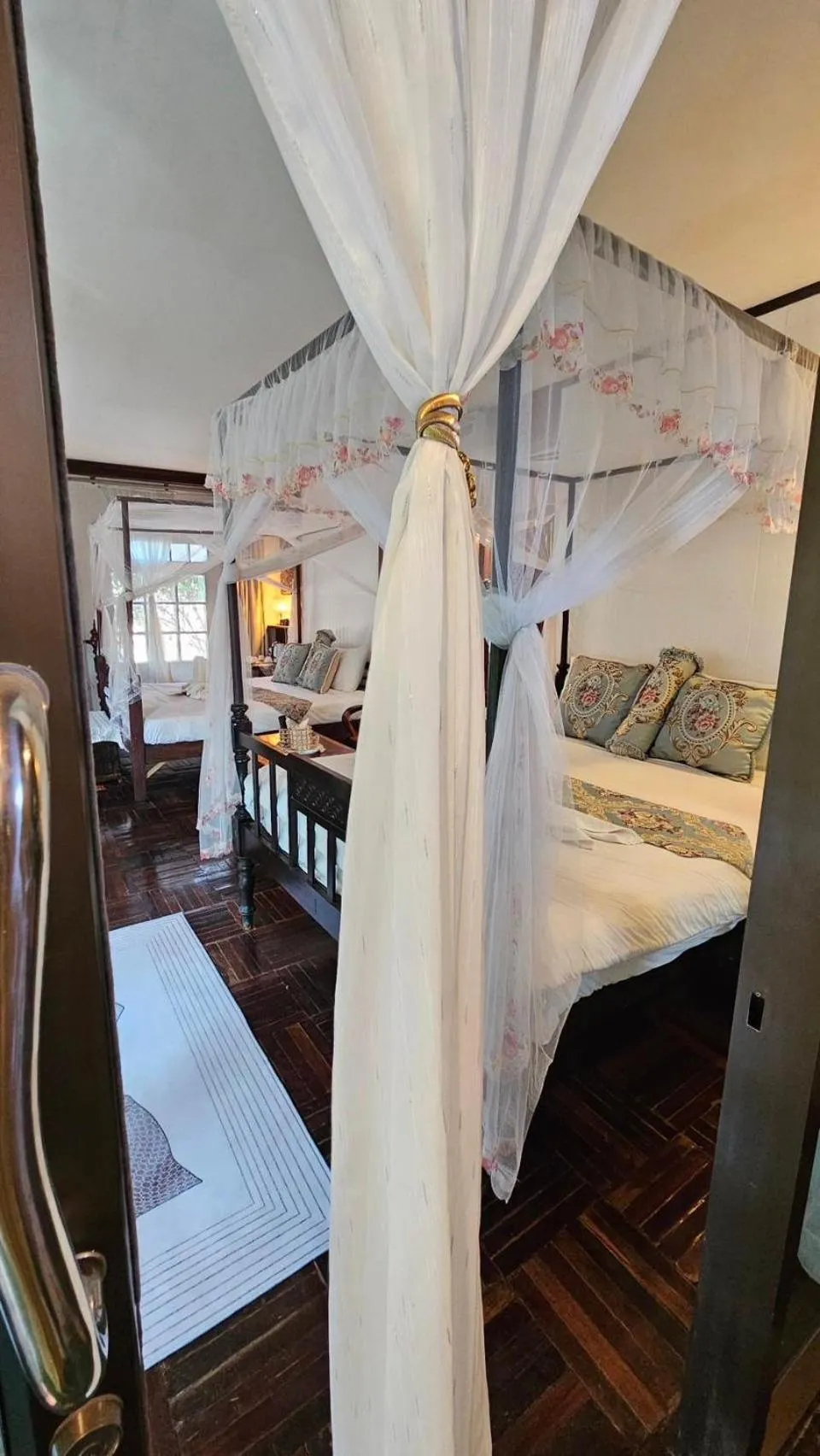 Bed in The Antique Riverside Resort