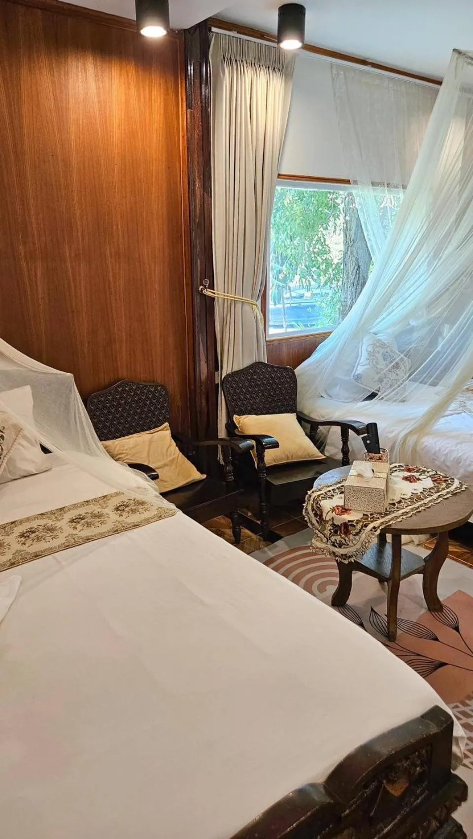 Bed in The Antique Riverside Resort