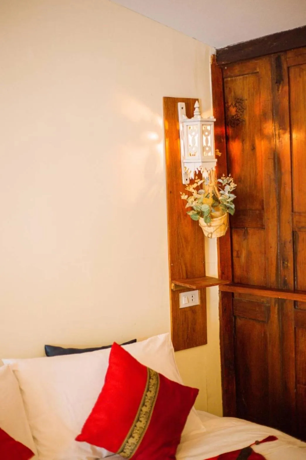 Bed in The Antique Riverside Resort