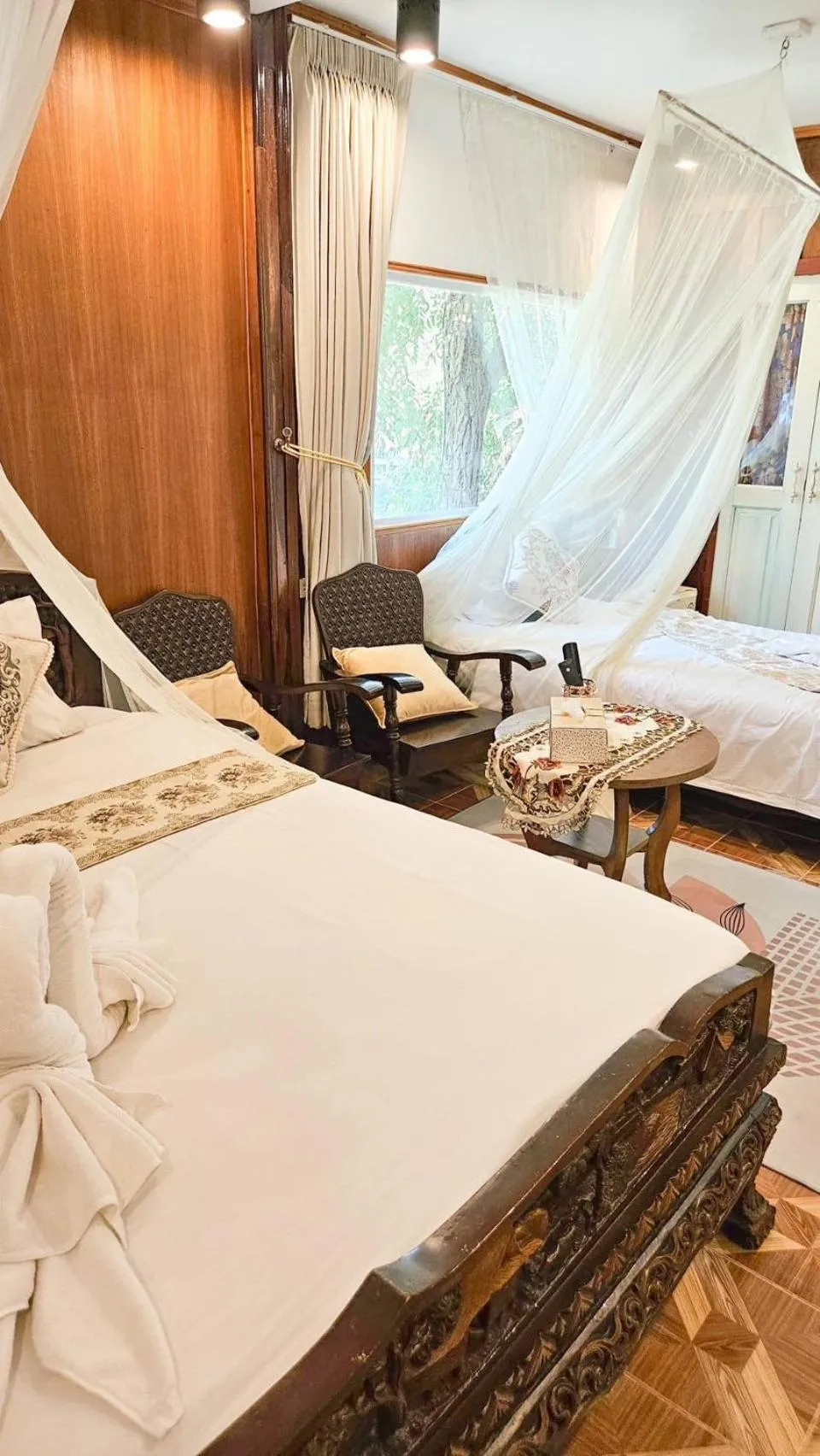 Bed in The Antique Riverside Resort