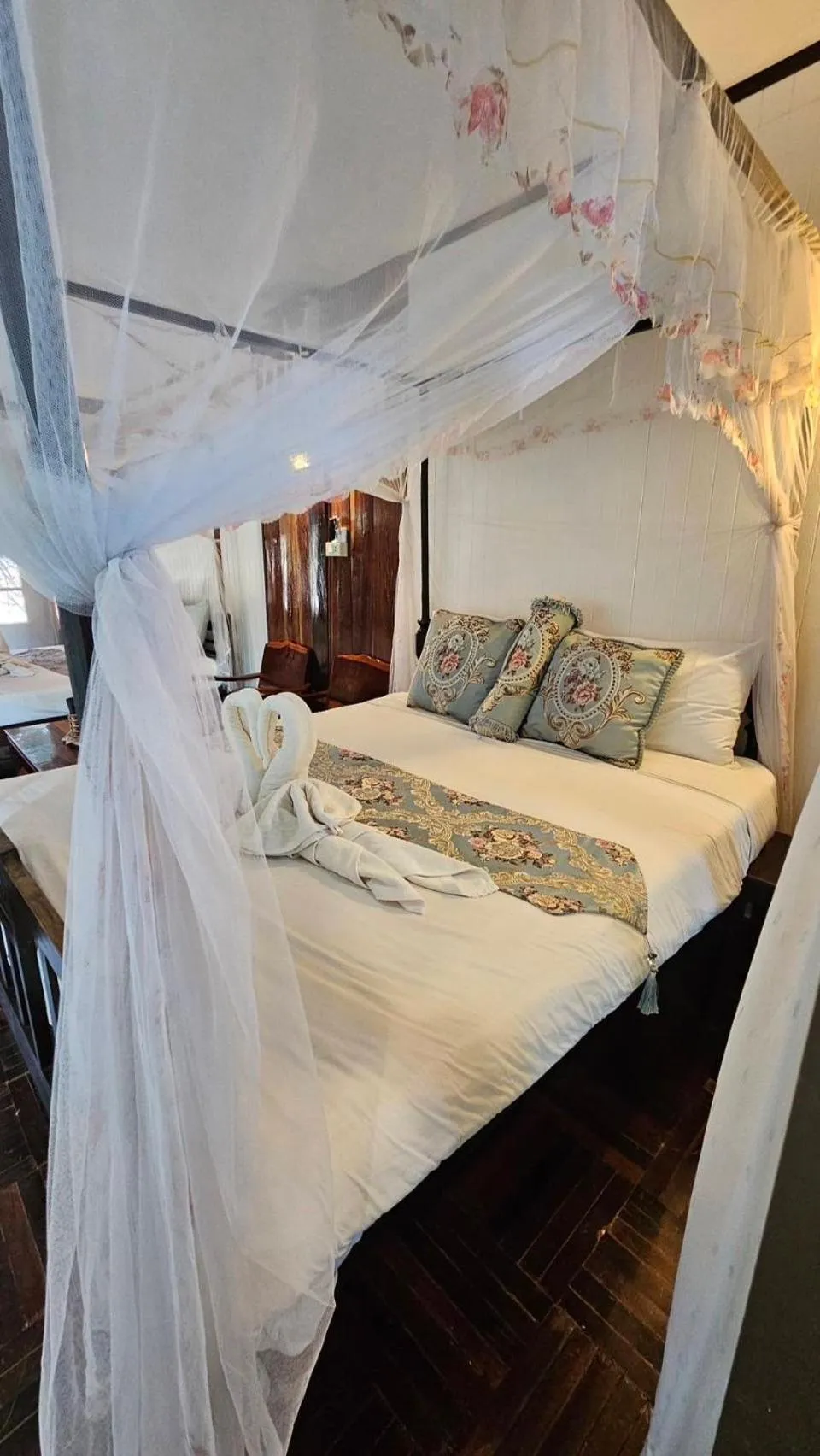 Bed in The Antique Riverside Resort