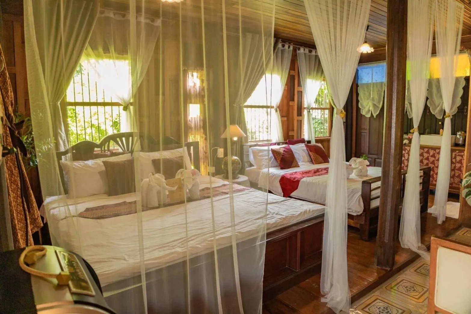 Bed in The Antique Riverside Resort