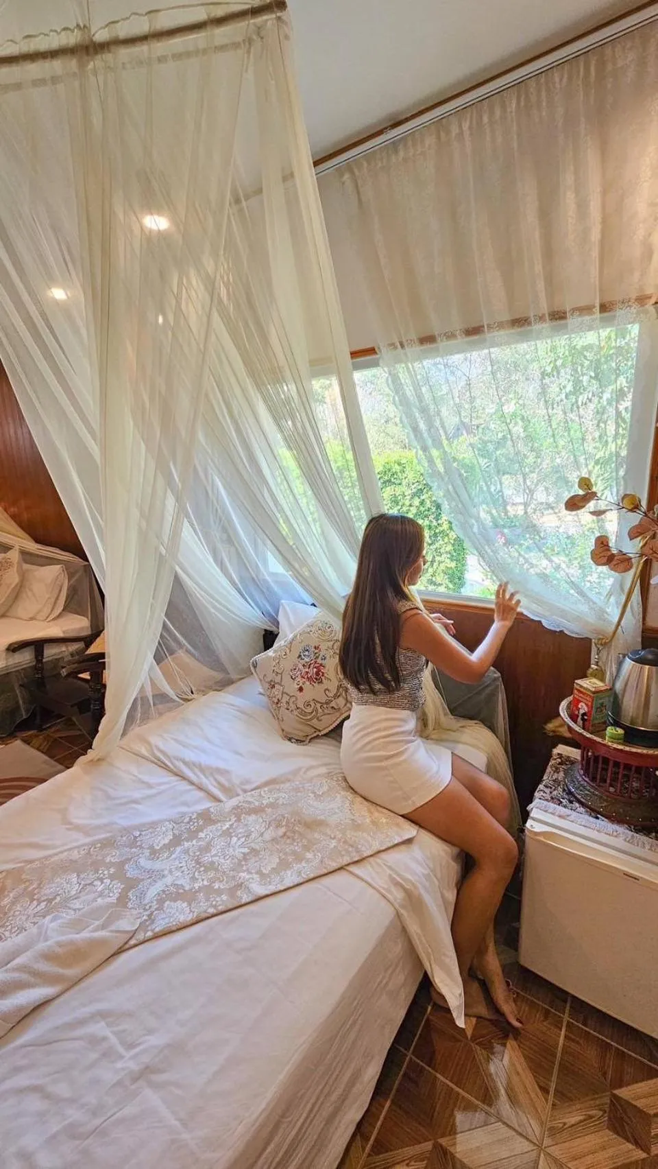 Bed in The Antique Riverside Resort