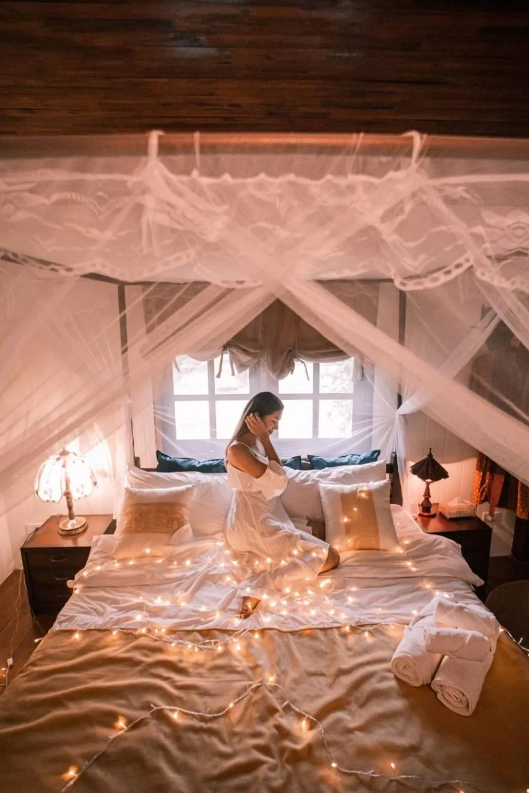 Bed in The Antique Riverside Resort