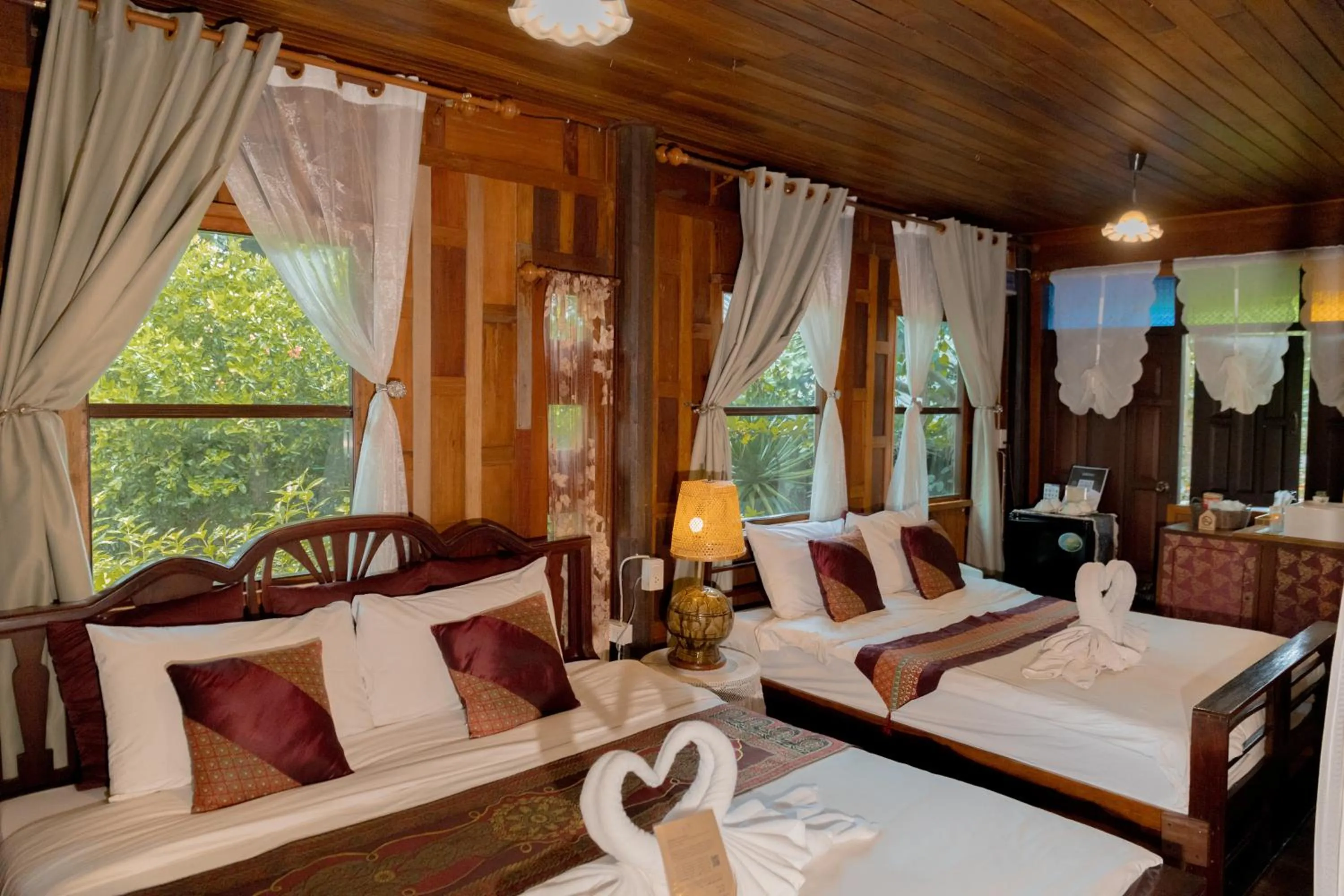 Bed in The Antique Riverside Resort
