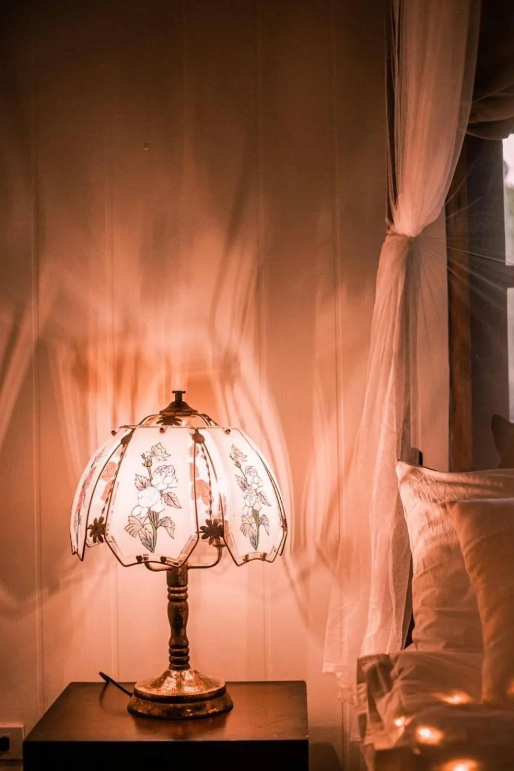 Bed in The Antique Riverside Resort