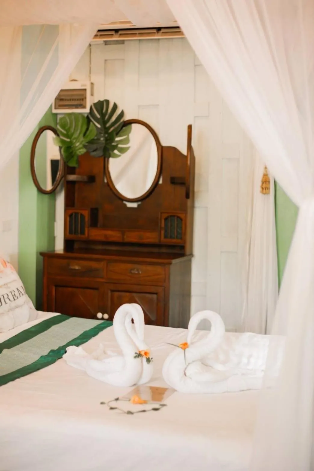 Bed in The Antique Riverside Resort