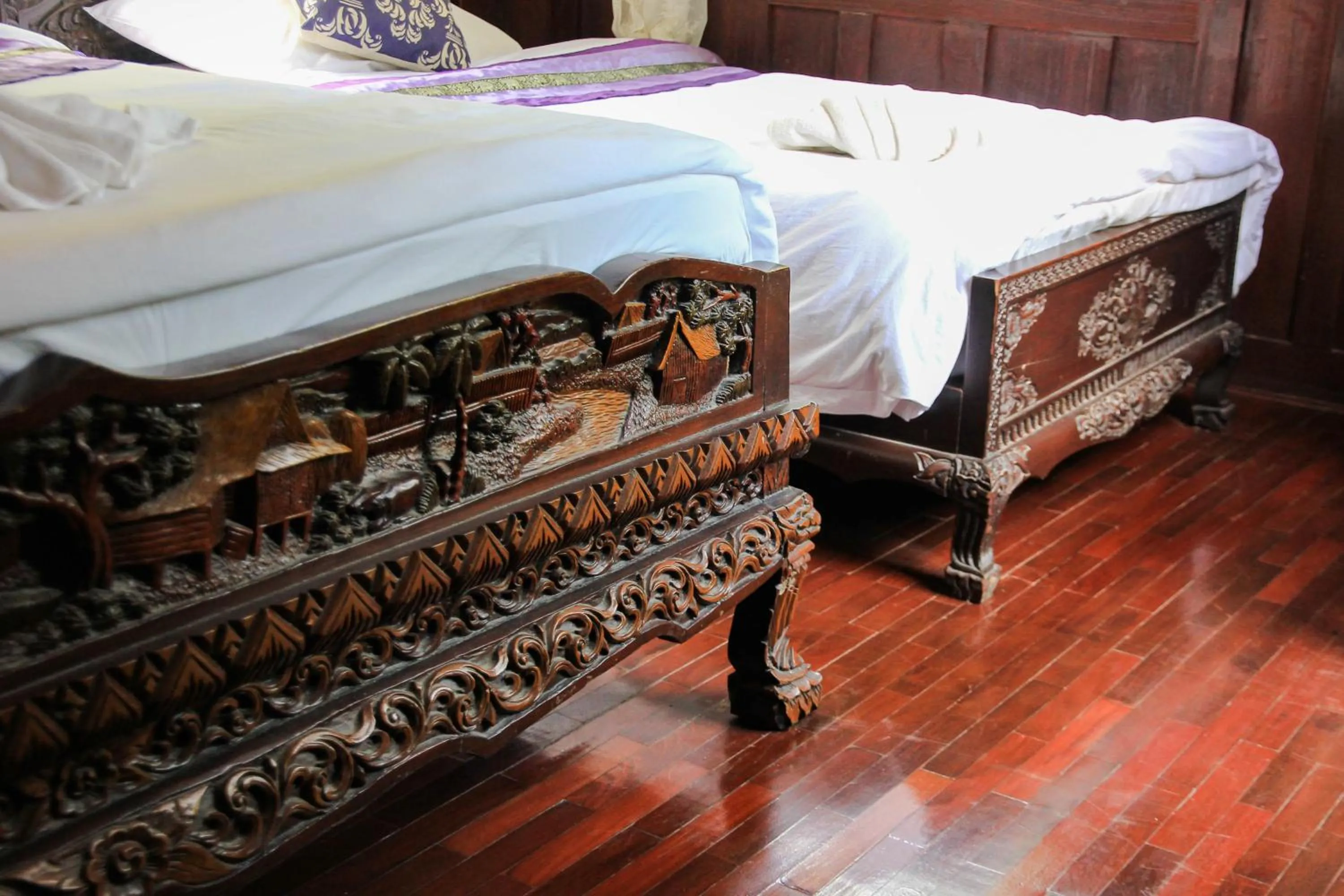 Bed in The Antique Riverside Resort