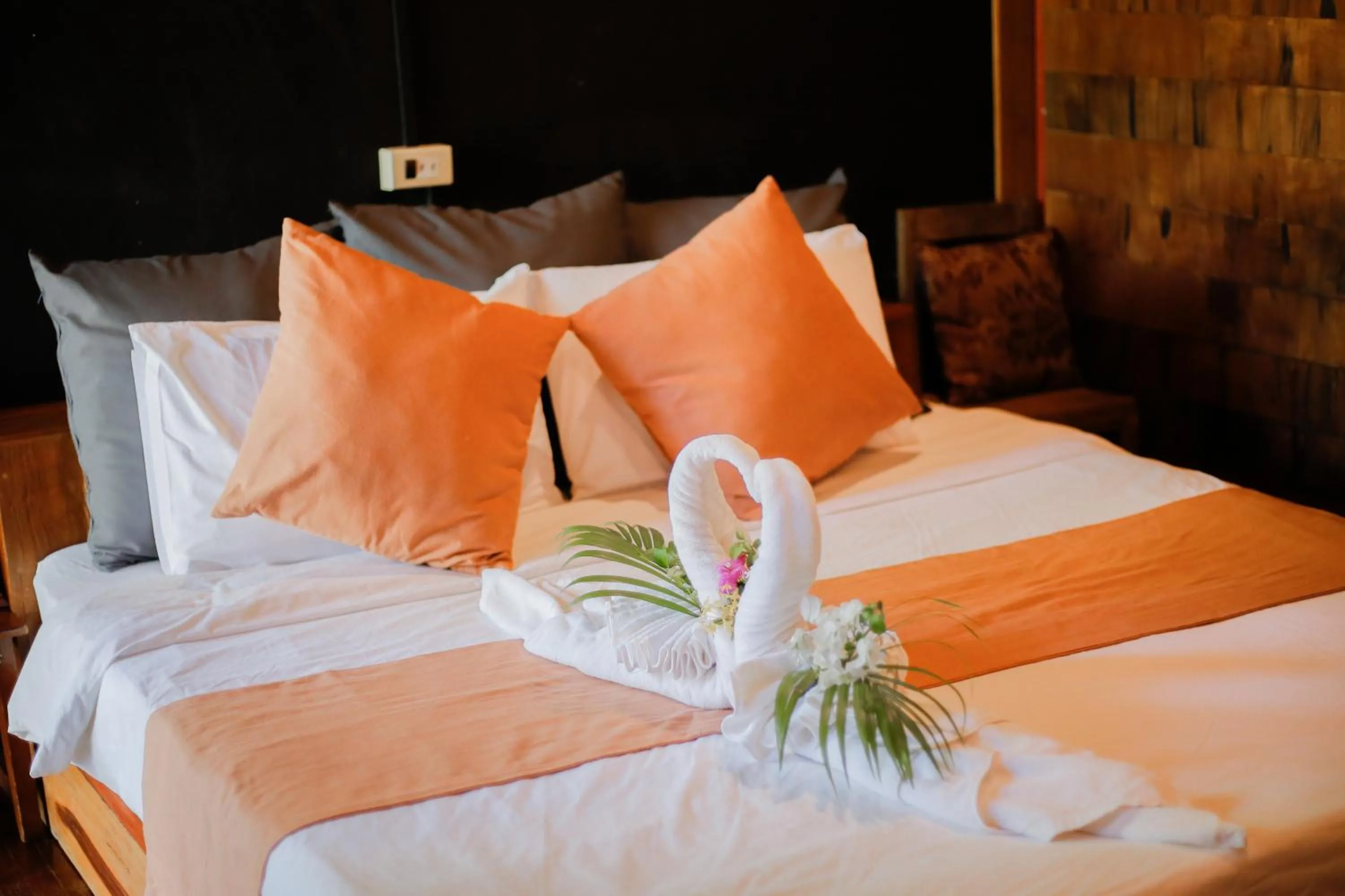 Bed in The Antique Riverside Resort