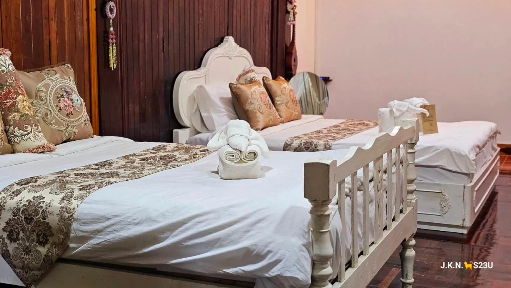 Bed in The Antique Riverside Resort