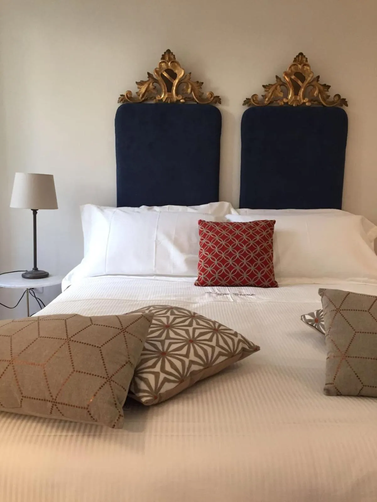 Bed in Palazzo Taranto Luxury Rooms
