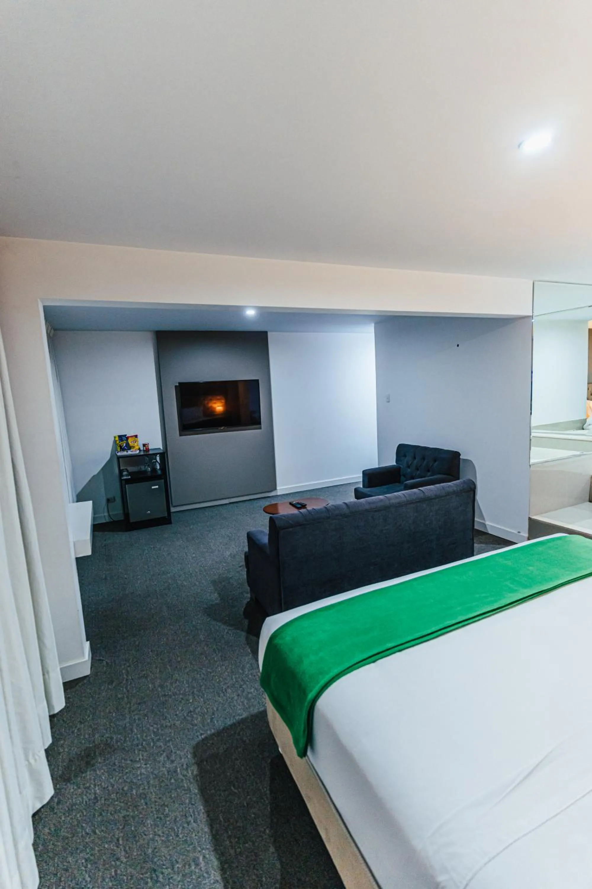 Communal lounge/ TV room, Bed in Hotel Hacienda Lima Norte