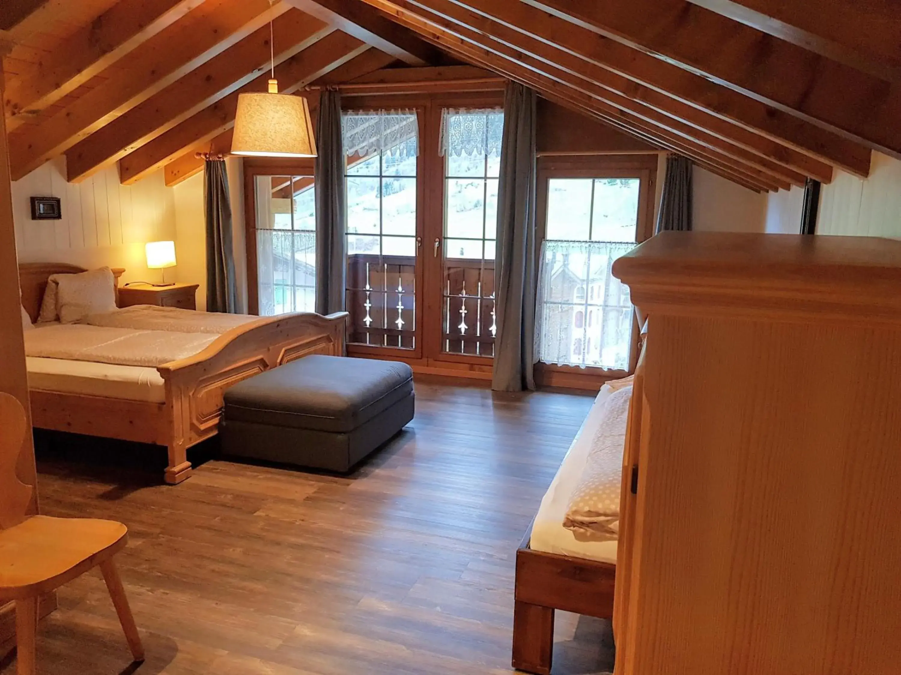 Deluxe Quadruple Room in Hotel Beau-Séjour Deluxe Quadruple Room in Hotel Beau-Séjour