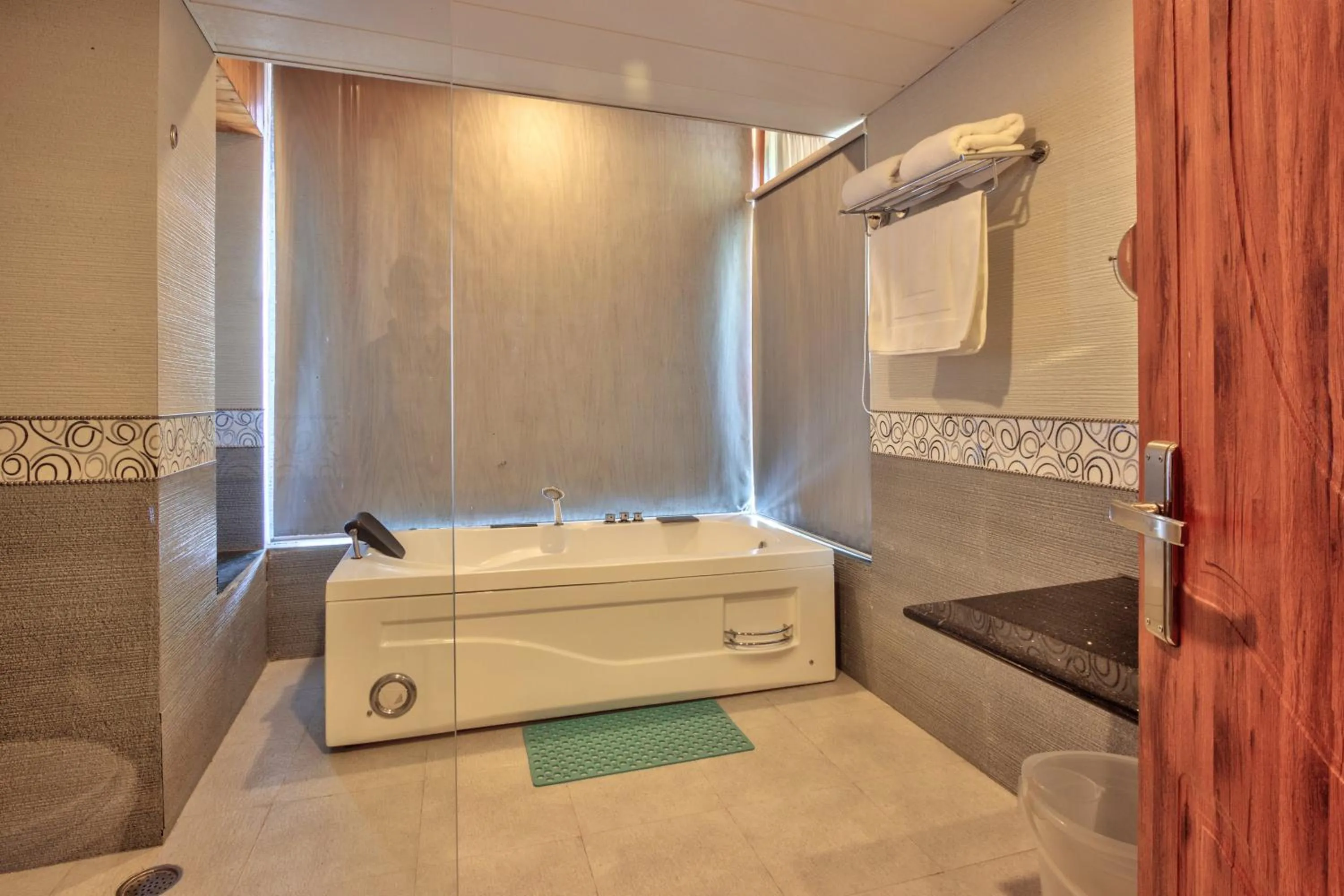 Bath in Snow Flakes Resort And Spa Centrally Heated Luxury Resort
