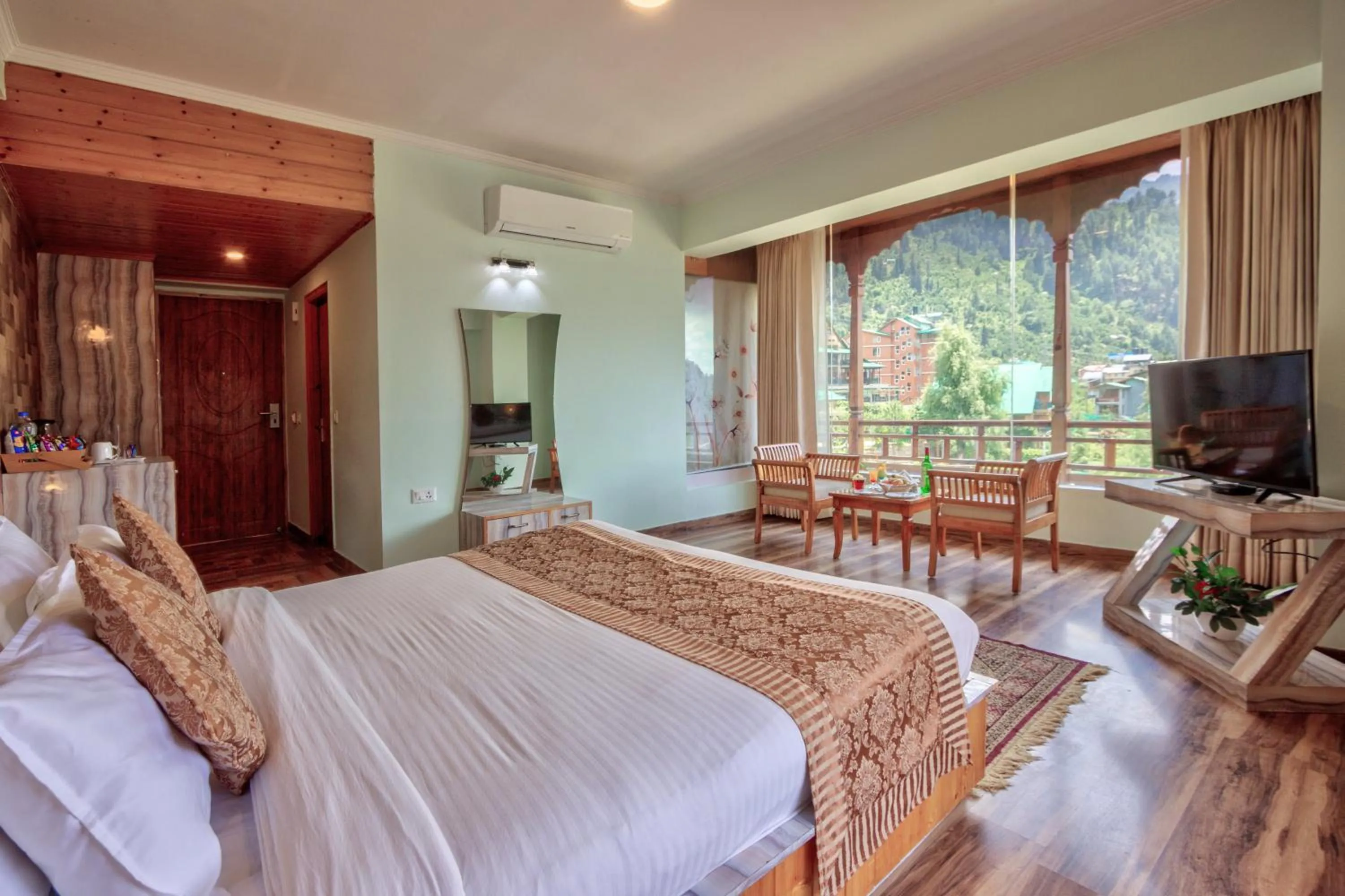 Communal lounge/ TV room, Bed in Snow Flakes Resort And Spa Centrally Heated Luxury Resort