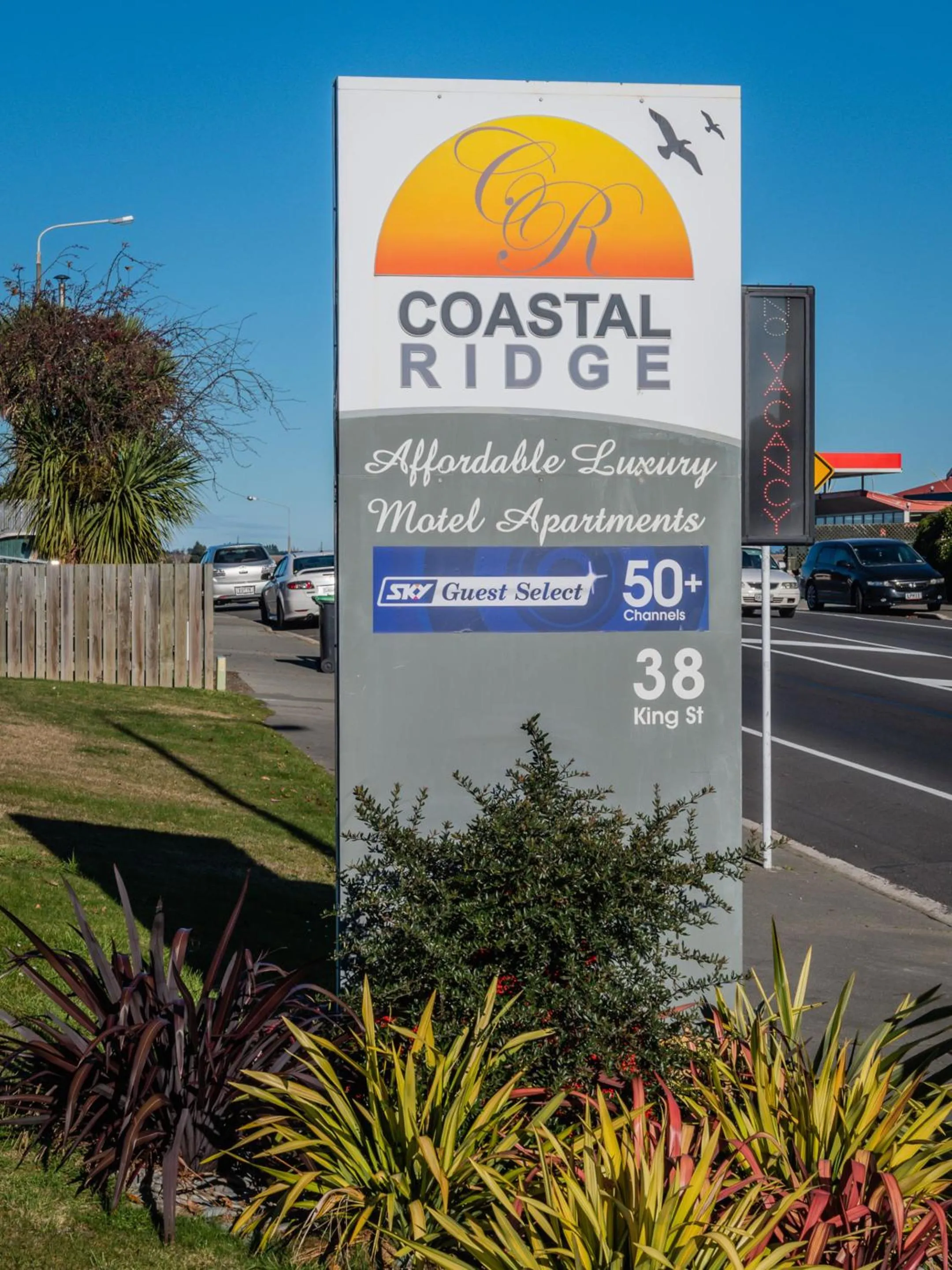 Property logo or sign in Coastal Ridge Apartments