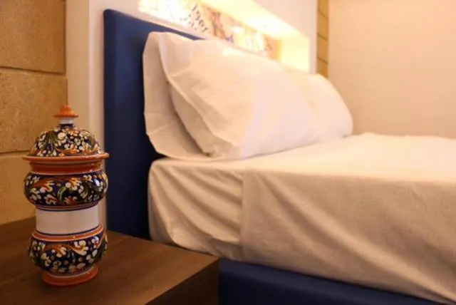 Bed in Mongibello Palace B&B